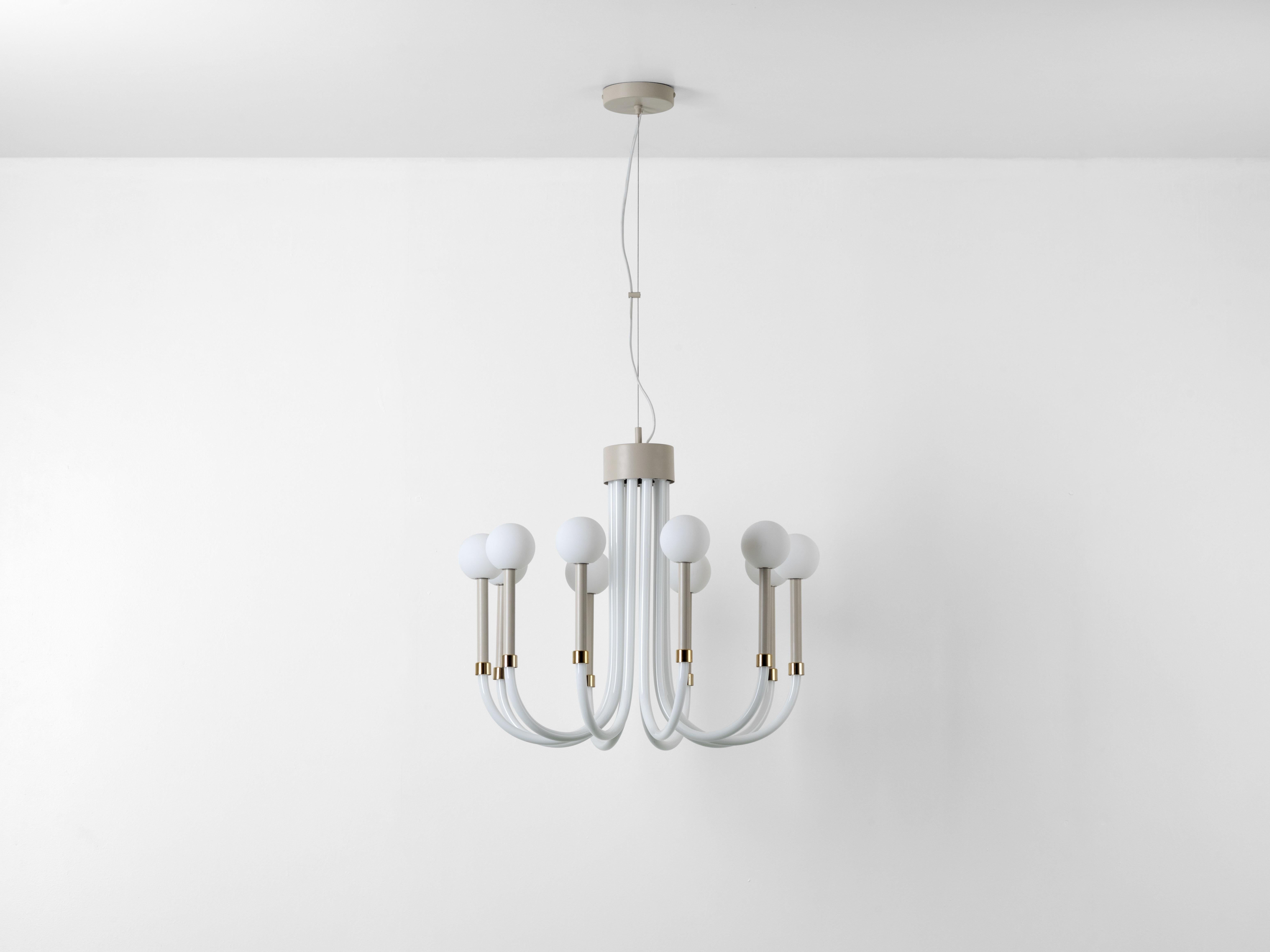 Illuminate your space with the opal ball chandelier. 10 opal glass orbs sit on beautifully curved metal arms, combining classic ideas with a contemporary twist. The result is a modern, sculptural and graphic take on a chandelier, with neutral tones