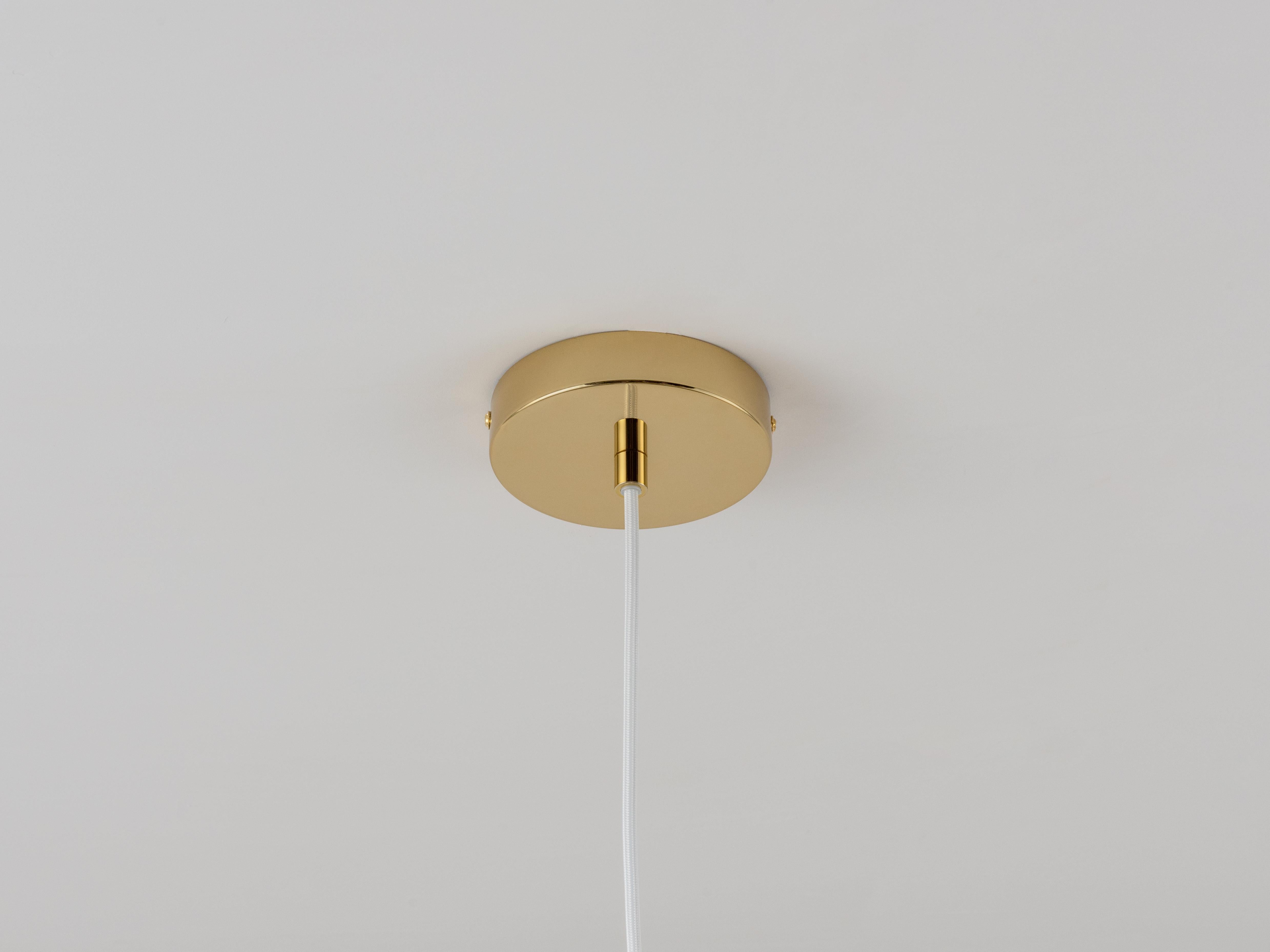 This elegant ceiling pendant is a nod to the classic French brasserie lights; it will work wonderfully in a cosy dining nook or even as the focal point in a living room. With polished brass metalware, the white milky glass imbues a comforting, soft