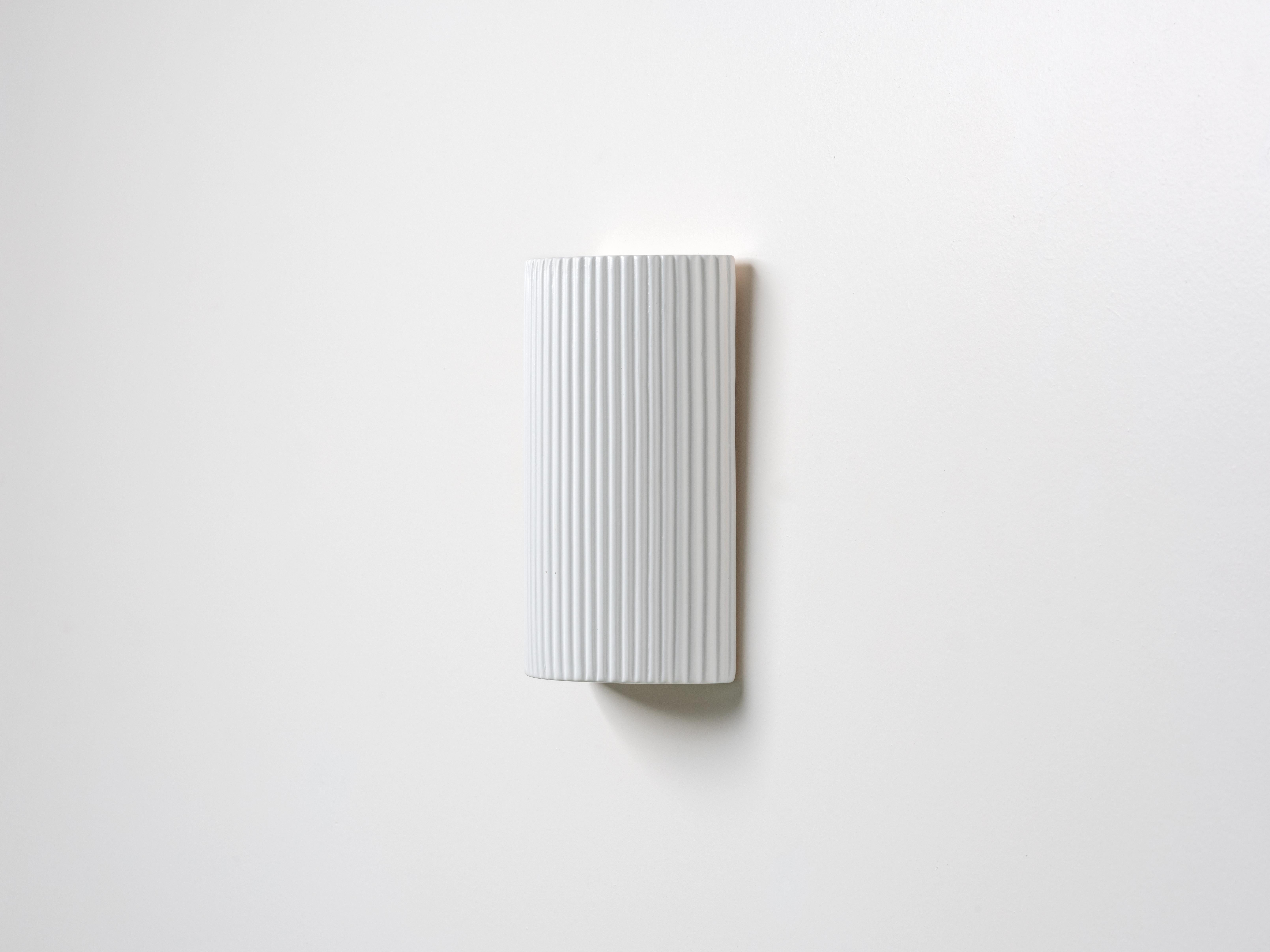 Please note this product is on pre order.

For use indoor and outdoor, the ceramic pillar wall light blends seamlessly into its surroundings, playing into the 2023 trend of embracing the influence of nature through form and functionality. Looks