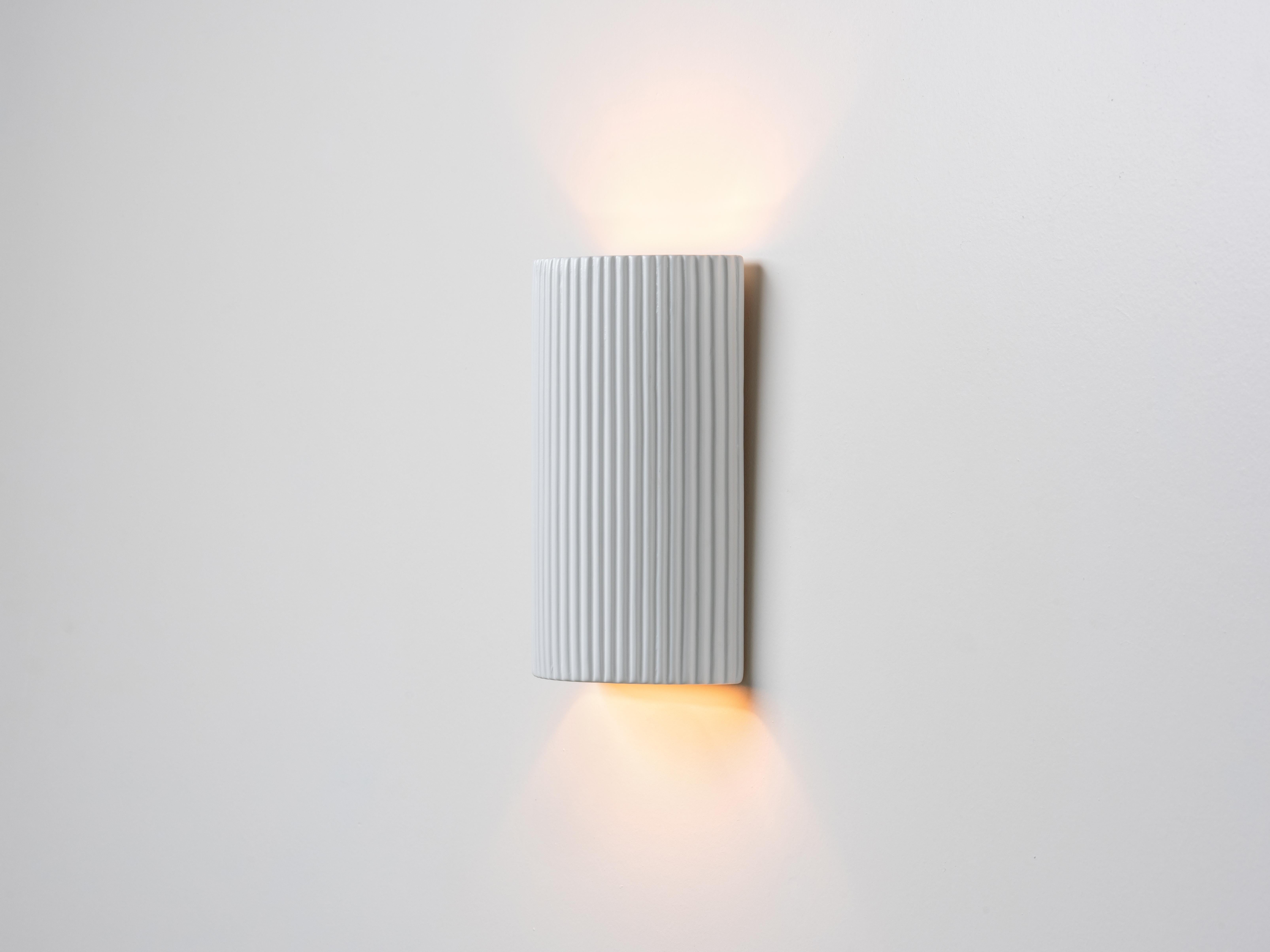 Mid-Century Modern Houseof White ribbed ceramic pillar wall light For Sale