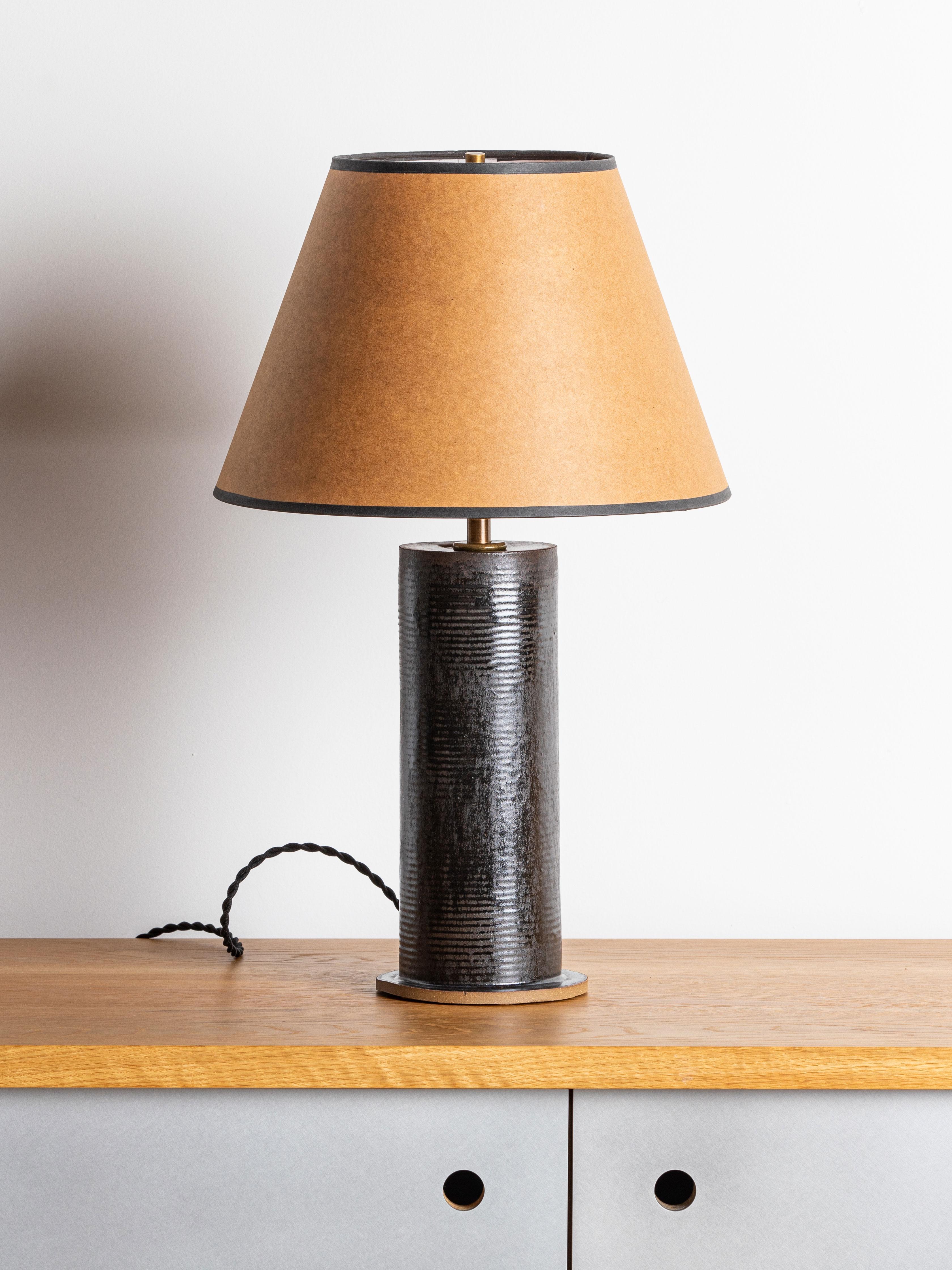Our stoneware Houston Lamp is handcrafted using slab-construction techniques. The lamp’s pattern is created by rolling the surface with textured rolling pins and rods.

FINISH

- Poured glaze, pictured in Lead
- Antique brass fittings
-