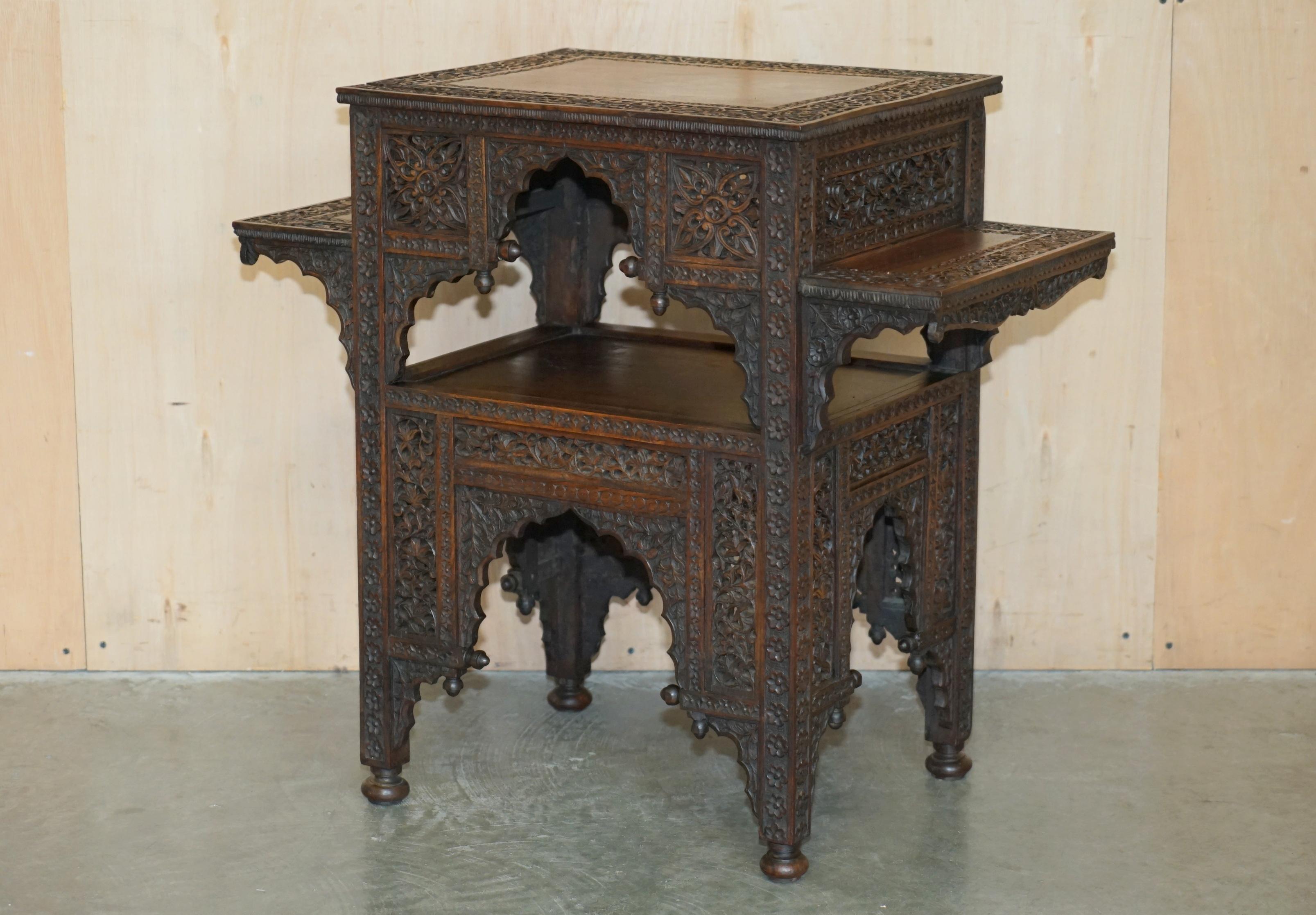 Royal House Antiques is delighted to offer for sale this exquisite, hand carved from top to bottom, four tier Liberty's of London Moorish occasional table 

Please note the delivery fee listed is just a guide, it covers within the M25 only for the
