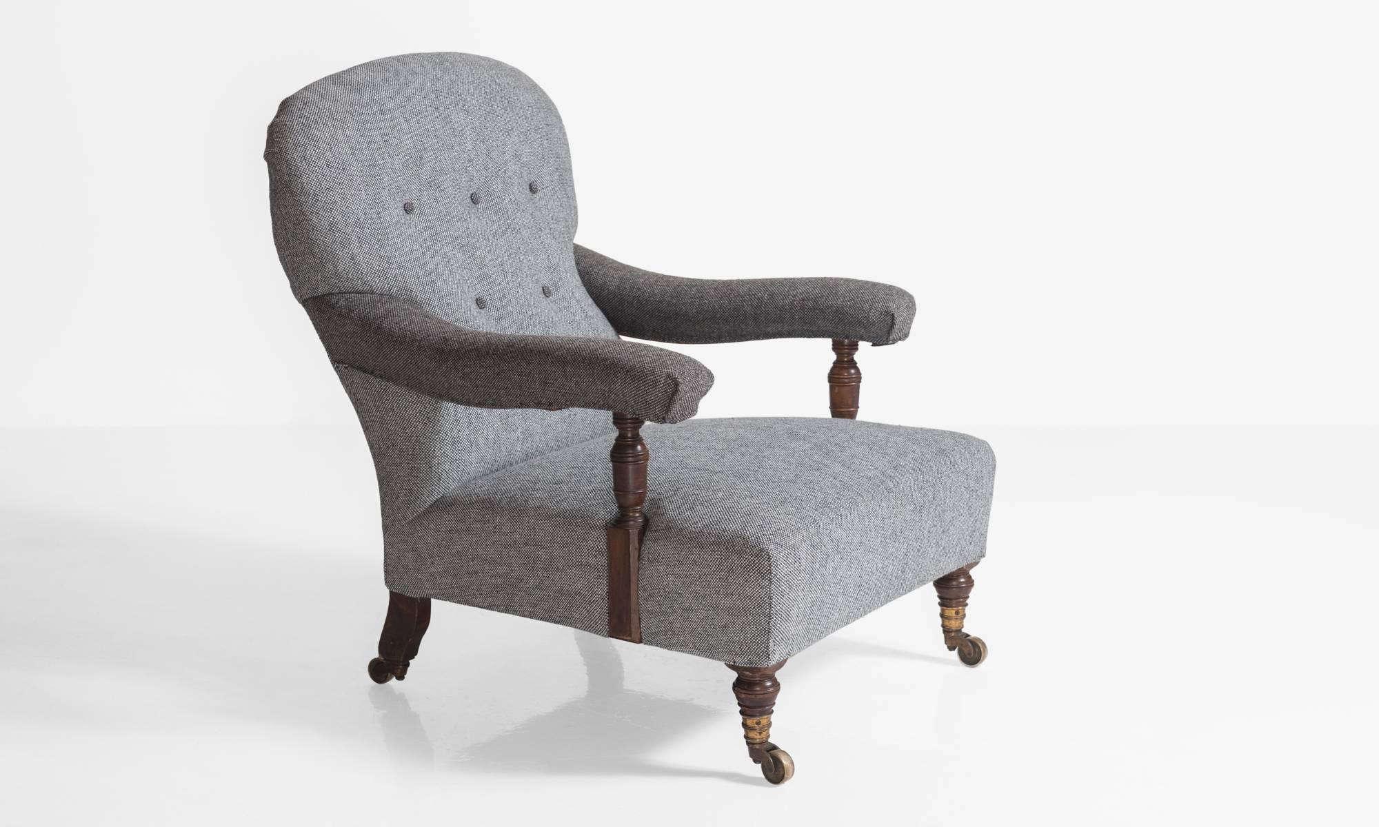 Howard & Sons Wool Armchair, England, circa 1890

Low armchair, by the London makers, Howard & Sons, reupholstered in contrasting Maharam Wool Fabric. Turned walnut supports and legs on original brass castors. 