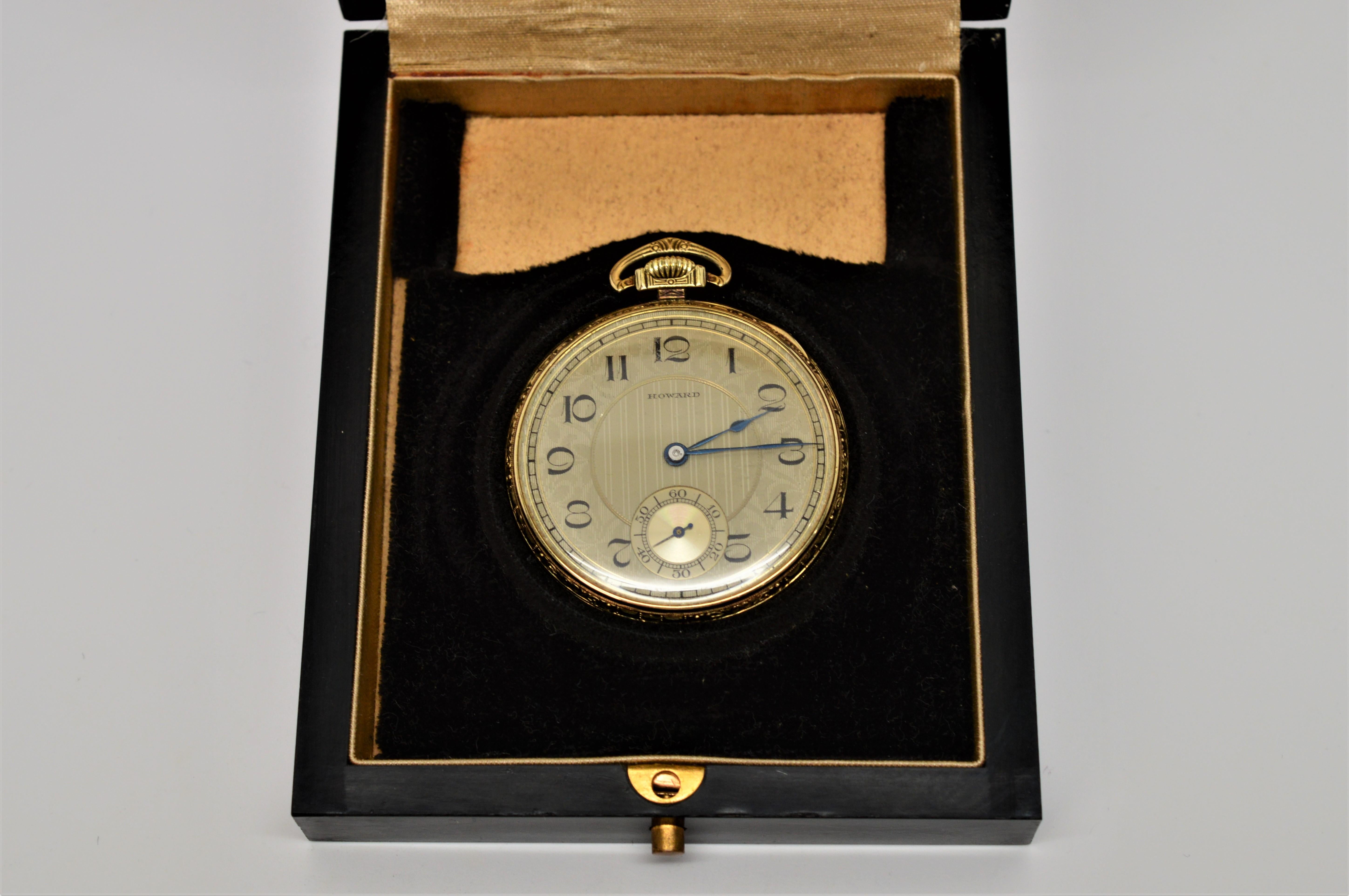 Handsome Howard 14 Karat Gold Plated Pocket Watch in original box with papers. 17 Jewel Movement #21998 / Case # 1553839. 
Measures 1-5/8 inch. In fine condition and works. In original box.   