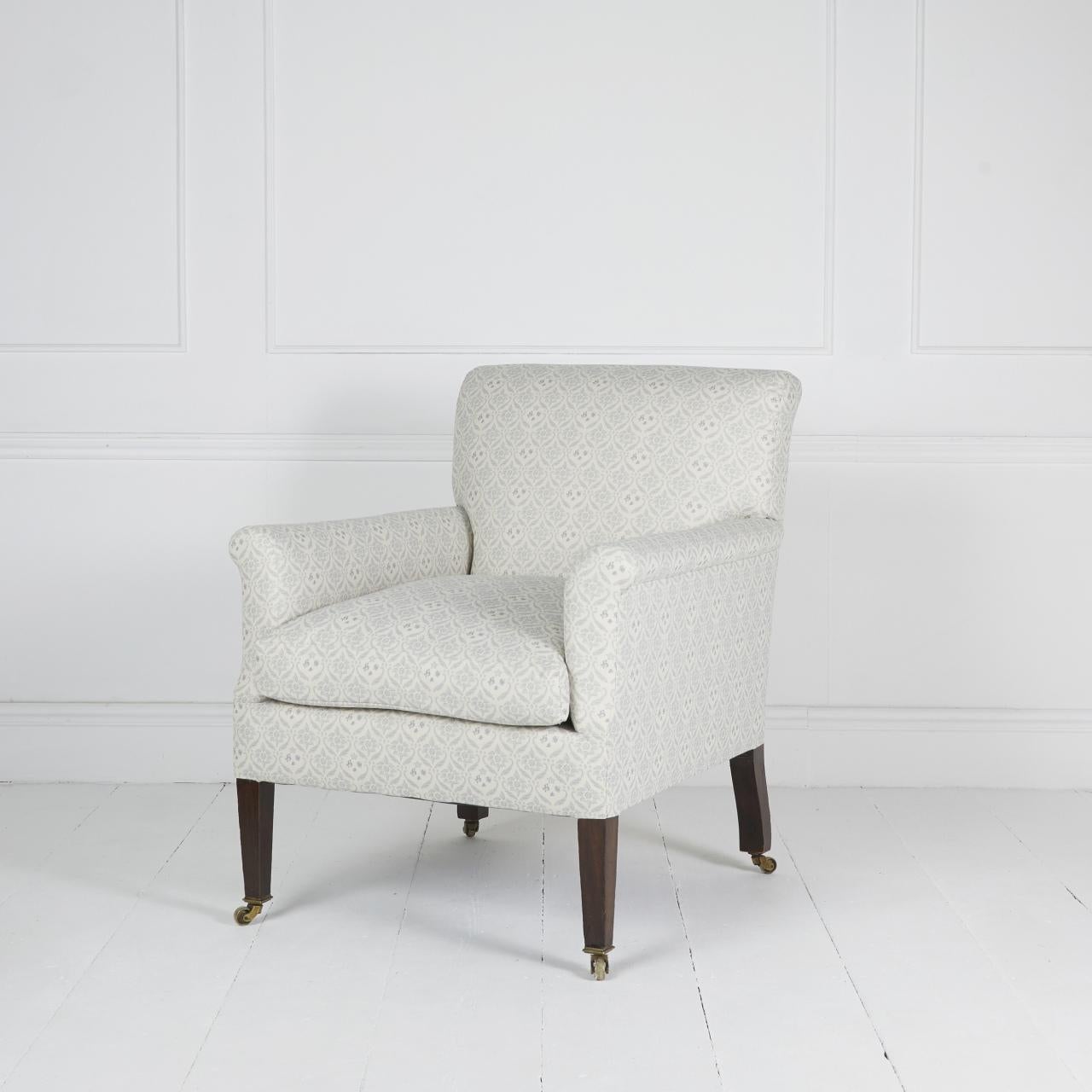 Rare “Dutton” model armchair by Howard and sons covered in H&S monogrammed organic cotton ticking standing on mahogany legs and original castors. Duck feather and down seat cushion.

Matched footstool available.

Dimensions: H 36″  W 29″ D 34″