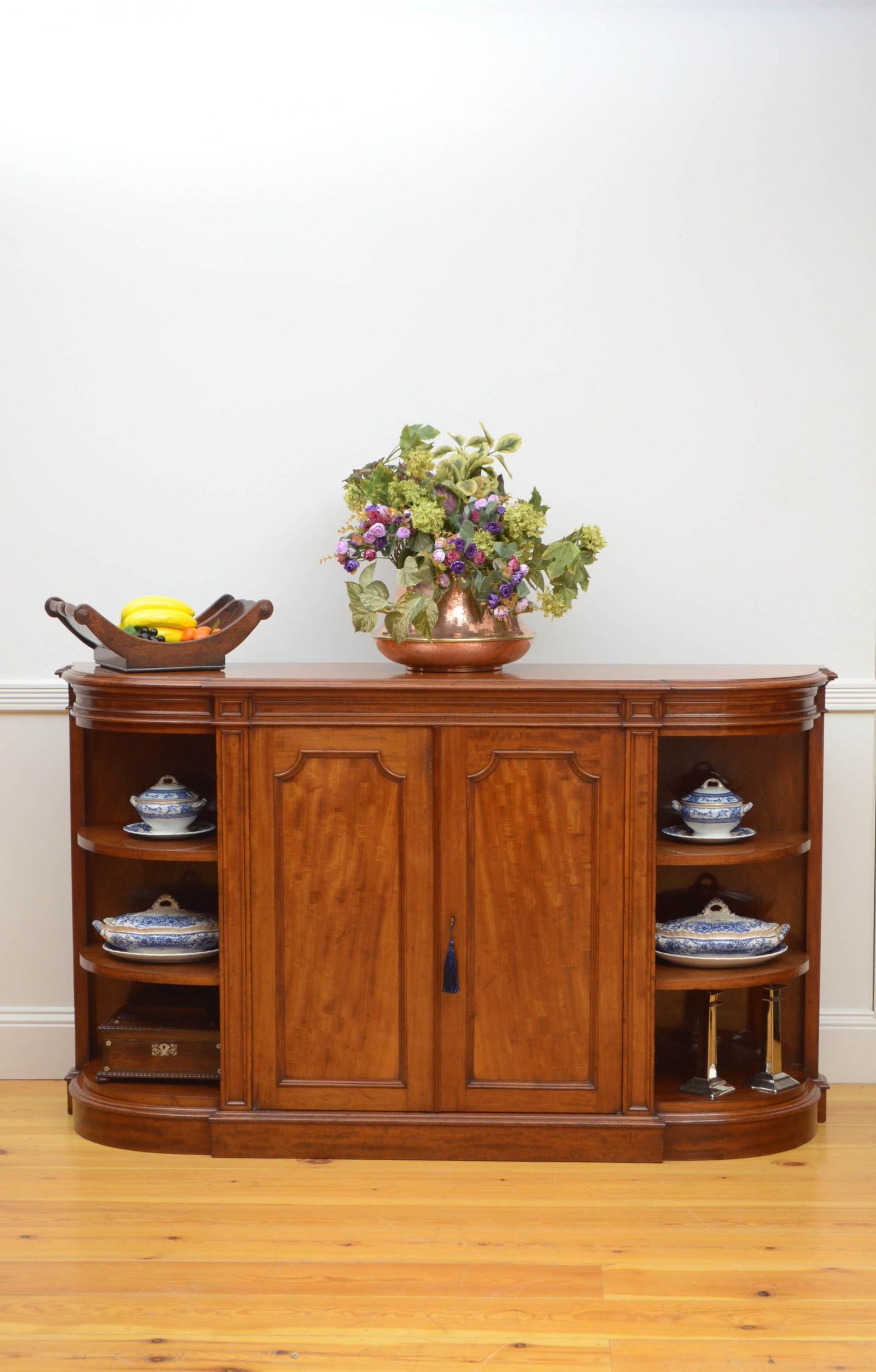 Sn4961, superb quality Victorian Howard and Sons mahogany sideboard, having figured mahogany top above shallow, paneled frieze and a pair of figured mahogany paneled doors, fitted with original working lock and a key and enclosing height adjustable