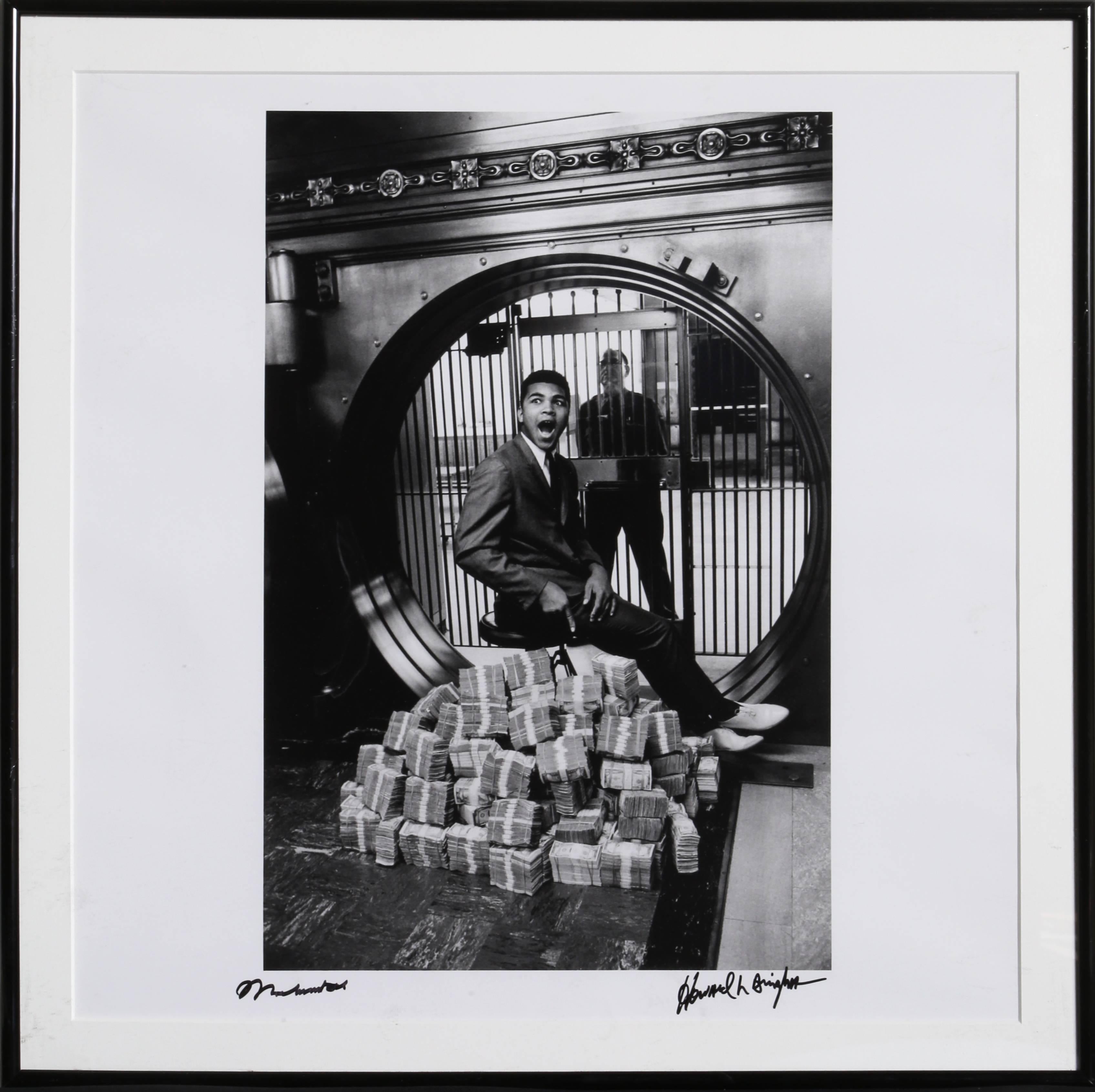 Artist: Howard Bingham, American (1939 - 2016)
Title: Muhammad Ali Sitting on a Million Dollars
Medium: Gelatin Silver Print Photograph, signed by Bingham and autographed by Ali in marker
Year: 1963 (printed 2003)
Image Size: 15.5 x 10.5