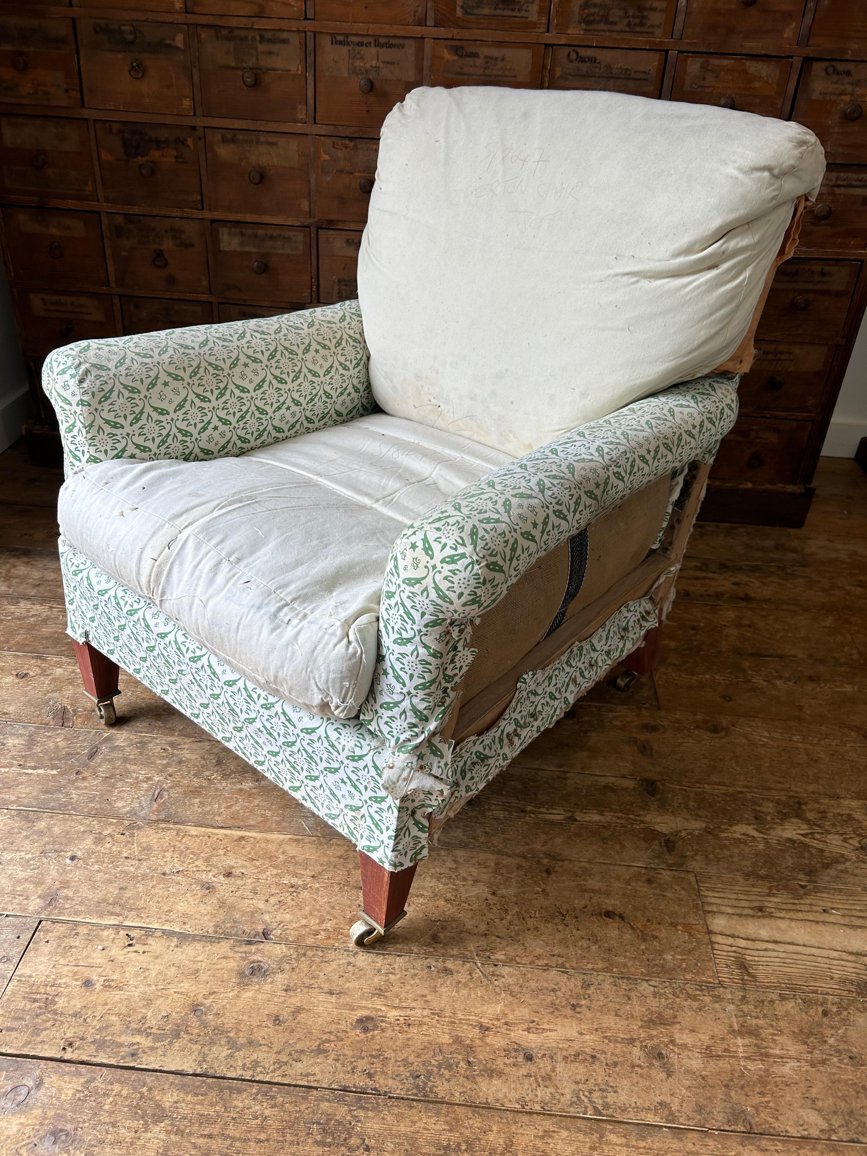 An extremely comfortable Howard Chair’s Ltd Egerton model arm chair, retaining its original H and S monogrammed ticking. The chair also has its original rear sack and feather and down cushion, with pencil inscription of the chair model and the