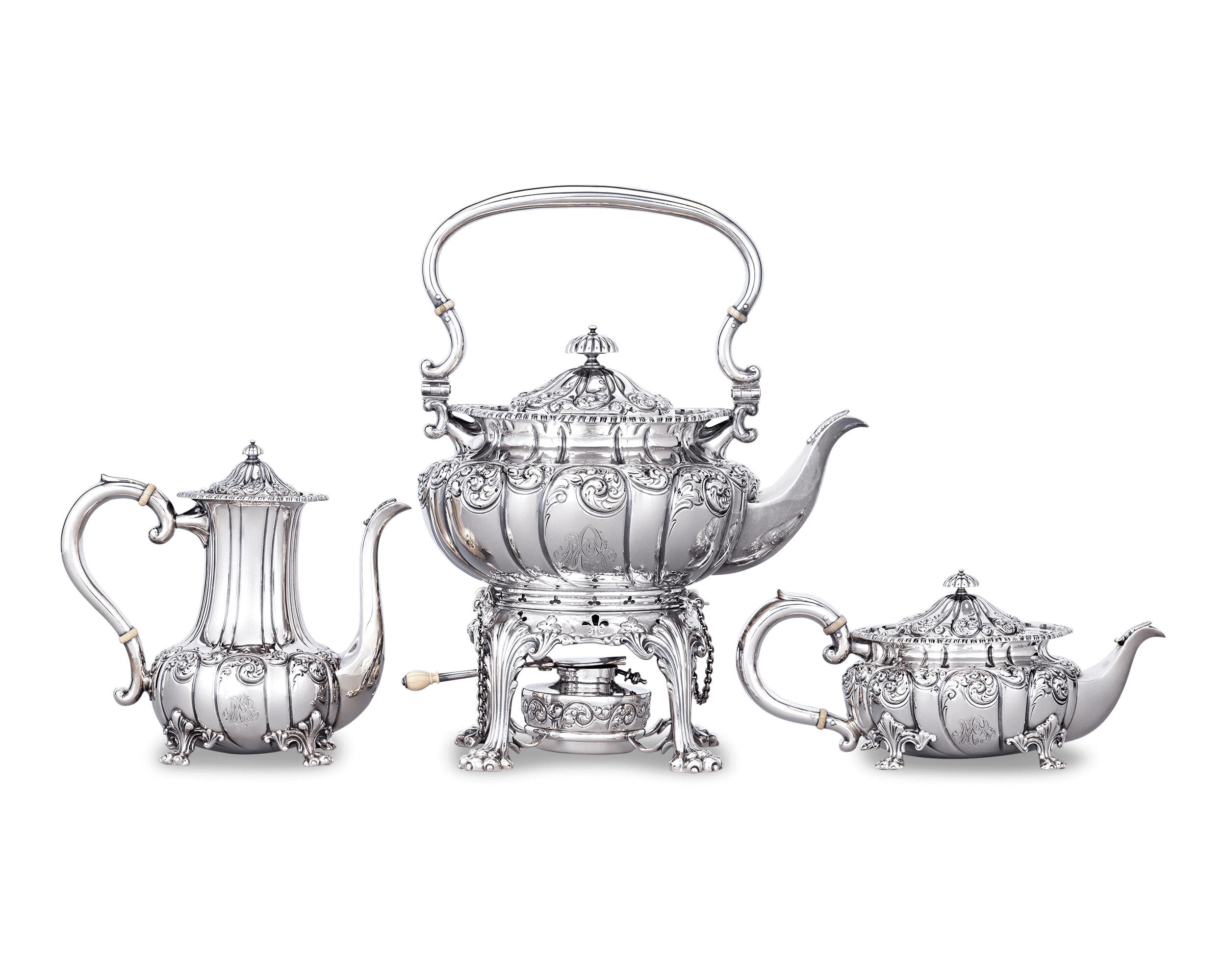 This rare and luxurious Victorian sterling silver tea and coffee service was crafted by New York silversmiths Howard & Co. Each piece — including a water kettle, tea pot, coffee urn, sugar, creamer, a waste bowl and bunsen warmer — has been