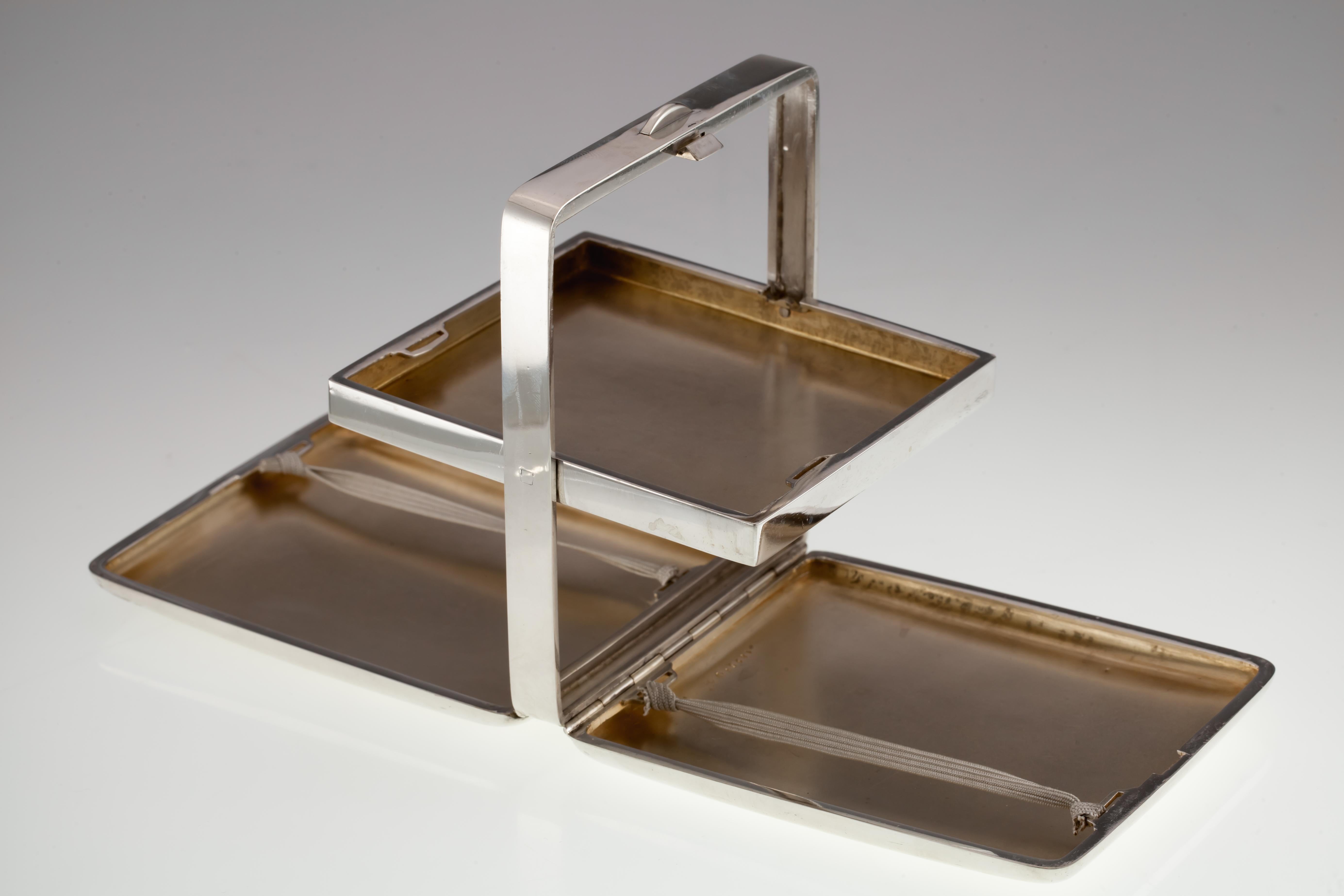 Howard & Co. Sterling Silver Heavy Displayable Cigarette Case w/ Tray
Gorgeous Displayable Cigarette Case with Included Tray
Case Opens Flat and Hinges Expose the Tray for Display
Dimensions of Case when closed = 108 x 88 x 28 mm
Dimensions when