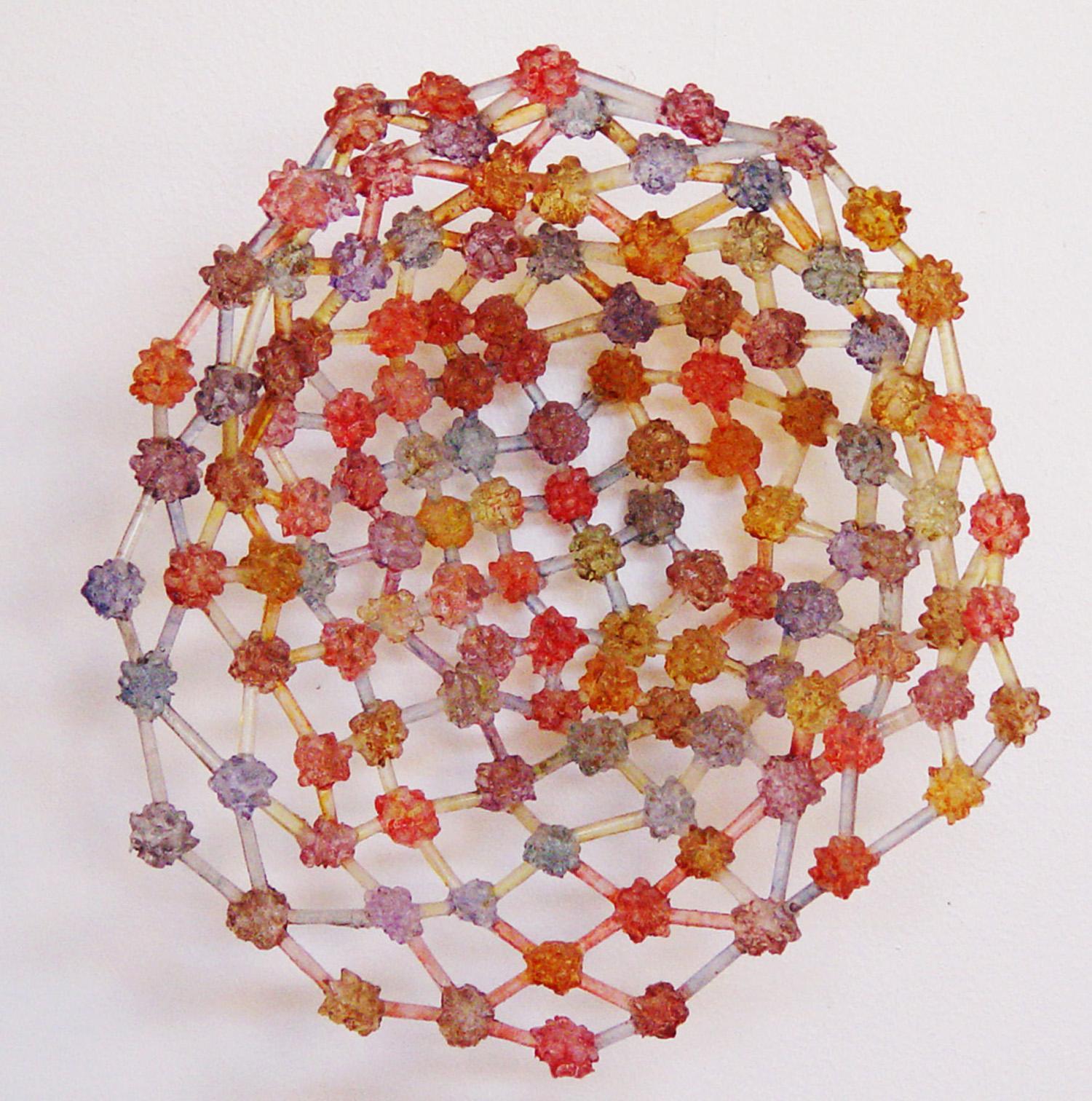 Howard Kalish Abstract Sculpture - "Basket"  cradles translucent red, yellow and blue blossom clusters