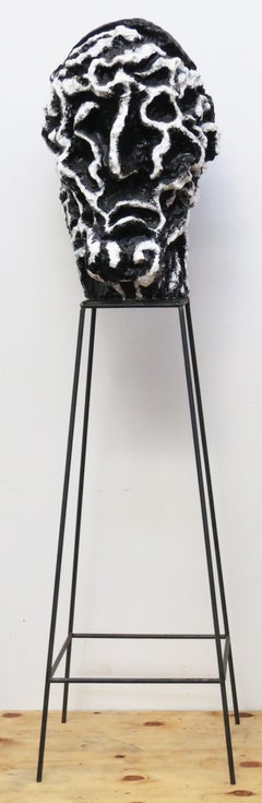 "Large Head (Patriarch)", twice life-size mythic head in stark black and white