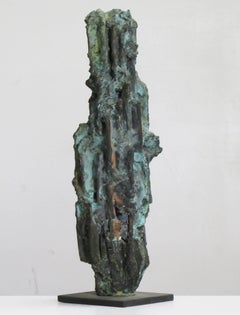 "Old Man", intricately carved, textured tabletop bronze with a blue green patina