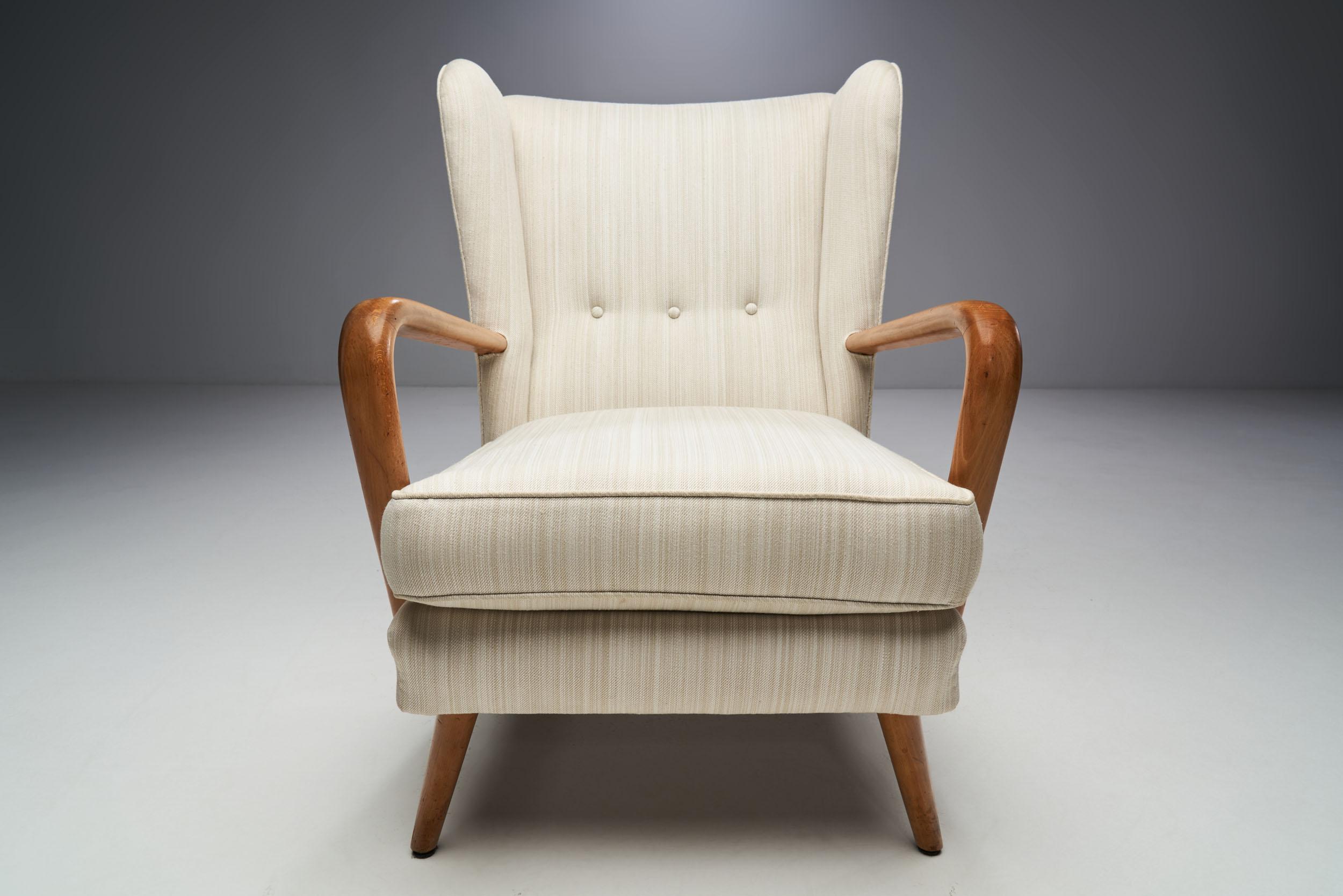 This Howard Keith “Bambino” armchair is a piece of history of a company, HK Furniture, and mid-century English design. By absorbing creative influences from abroad, but formulating a distinctive home-grown approach, Howard Keith was among the