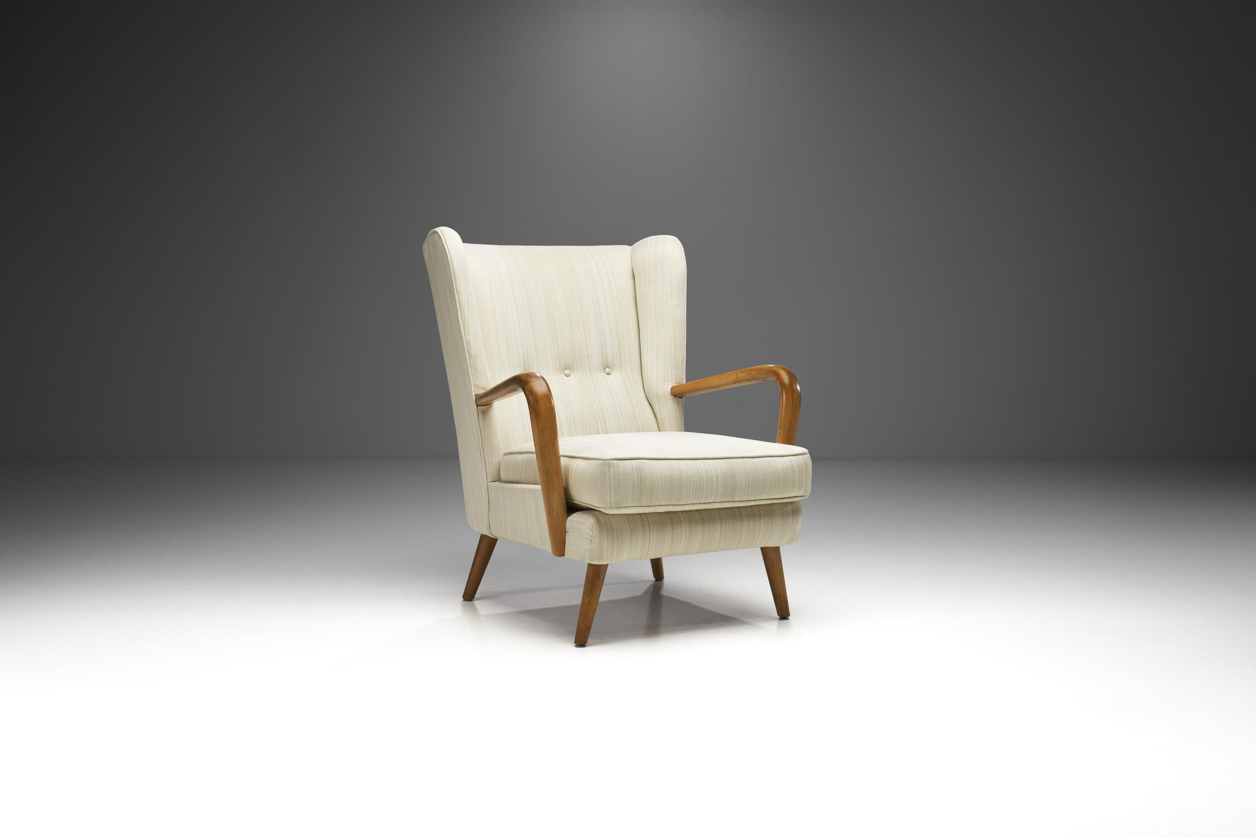 This Howard Keith “Bambino” armchair is a piece of history of a company, HK Furniture, and mid-century English design. By absorbing creative influences from abroad, but formulating a distinctive home-grown approach, Howard Keith was among the