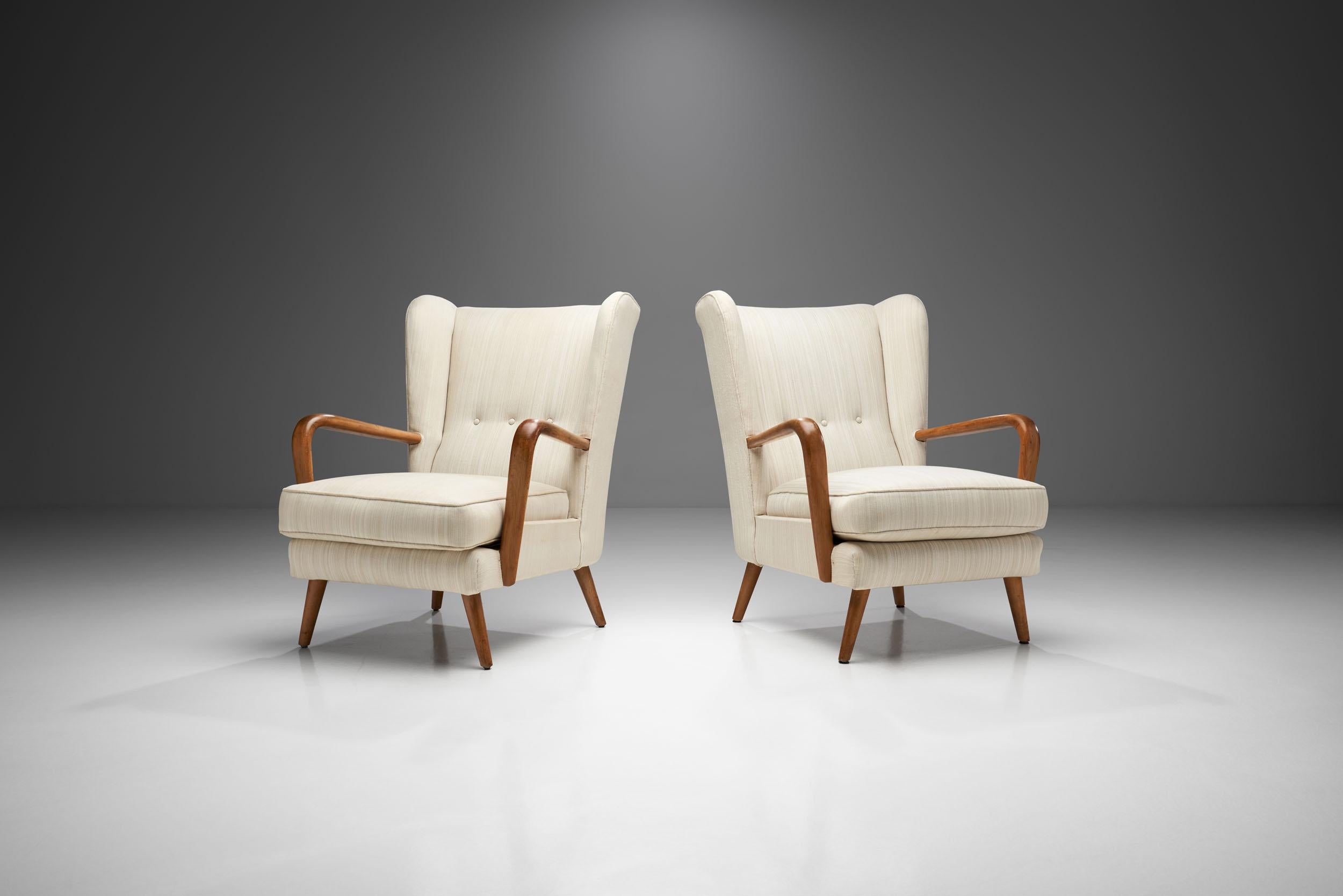 This present pair of Howard Keith “Bambino” armchairs is a piece of history of a company, HK Furniture, and mid-century English design. By absorbing creative influences from abroad, but formulating a distinctive home-grown approach, Howard Keith was