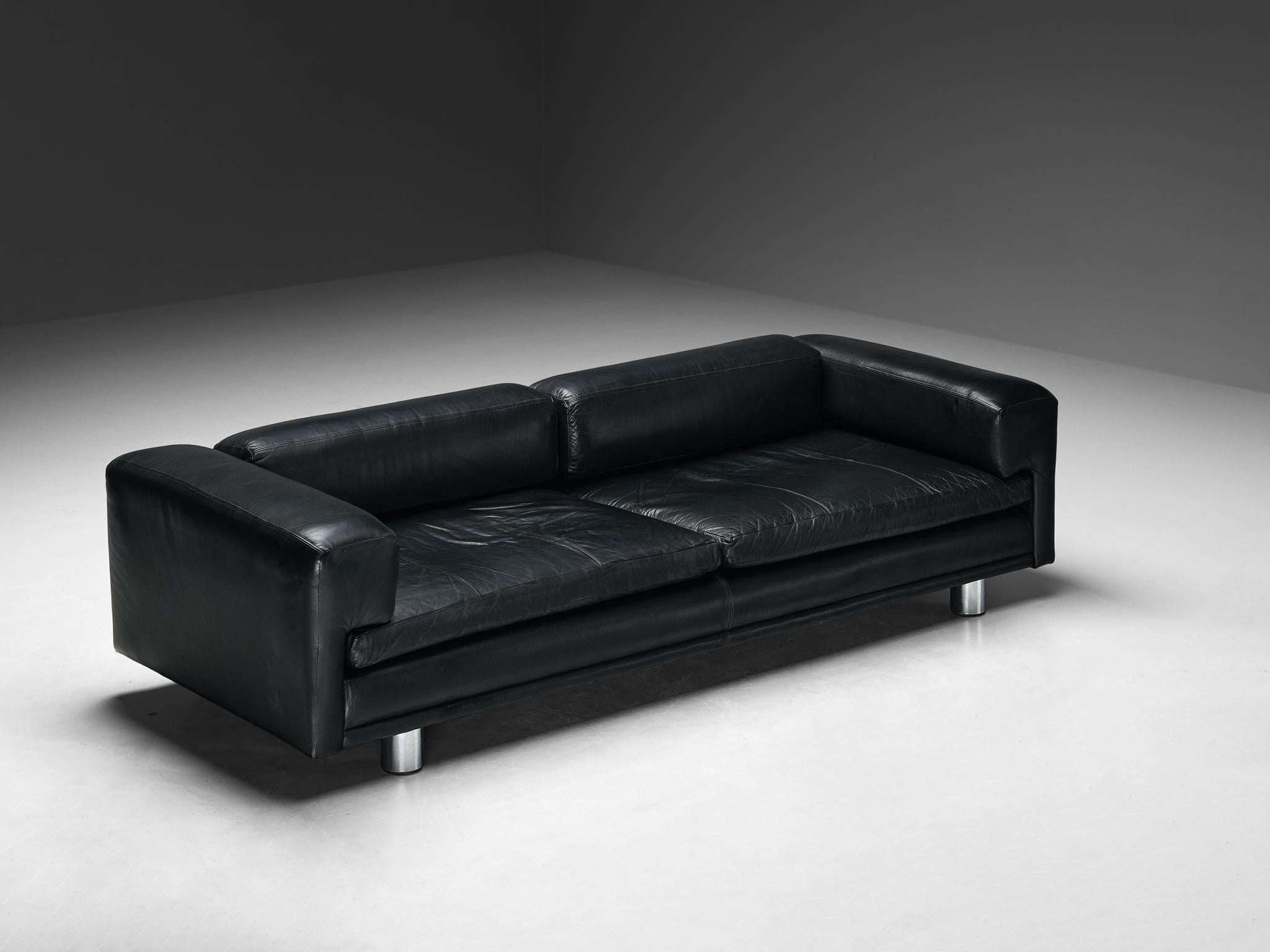 Howard Keith for HK Furniture, 'Diplomat' sofa, leather, chrome-plated steel, United Kingdom, 1970s

The 'Diplomat' sofa, with its voluptuous design, stands as a timeless symbol for design excellence. The black leather upholstery seamlessly