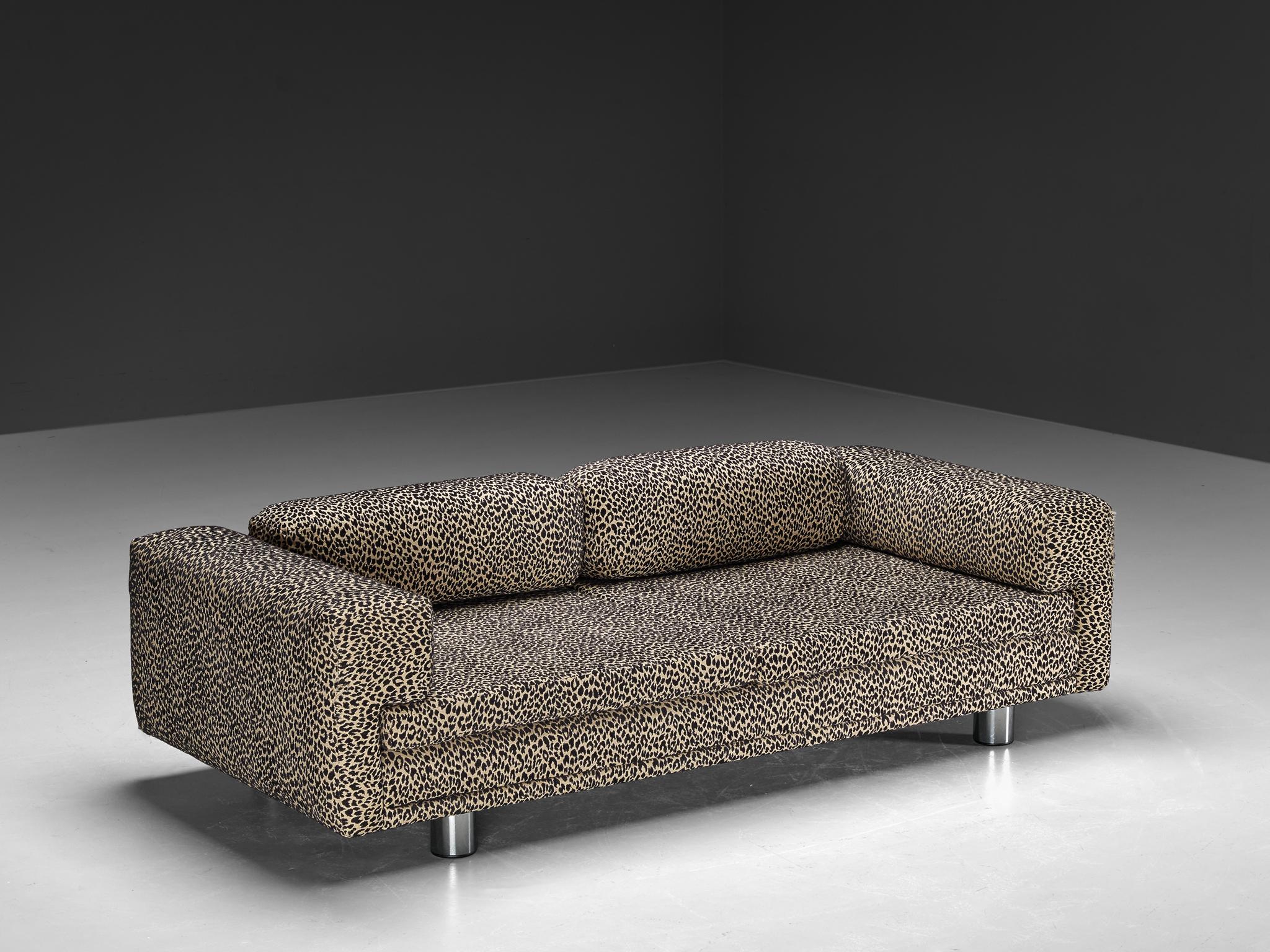 Howard Keith for HK Furniture, 'Diplomat' sofa, fabric, chrome-plated steel, United Kingdom, 1970s

The 'Diplomat' sofa, with its voluptuous design, stands as a timeless symbol for design excellence. The bold combination of black and beige leopard