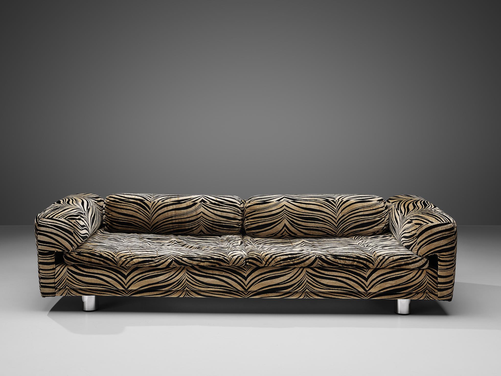 Howard Keith for HK Furniture, 'Diplomat' sofa, fabric, chrome-plated metal, United Kingdom, 1970s

This grand voluptuous ‘Diplomat’ sofa finds itself at the intersection of art and design. The exceptional and unique upholstery is executed in