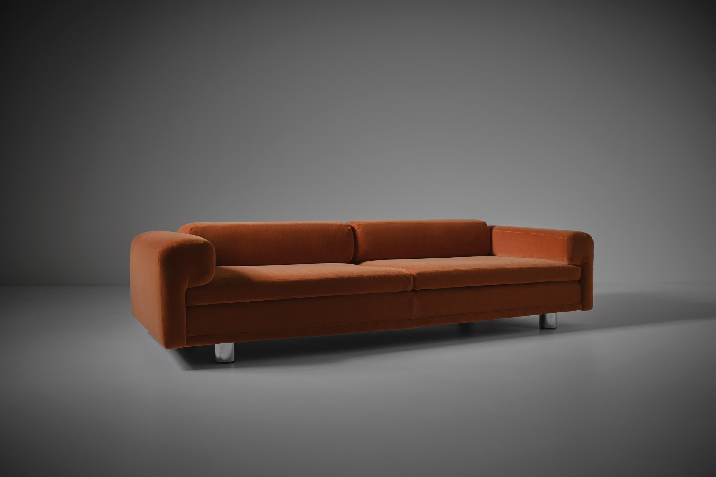 Large 'Diplomat' sofa by Howard Keith for HK Furniture, United Kingdom, 1970s. Interesting sleek design composed of several interlocking block shapes on cylindrical-shaped chrome legs with wooden end caps, providing a nice mid century modern