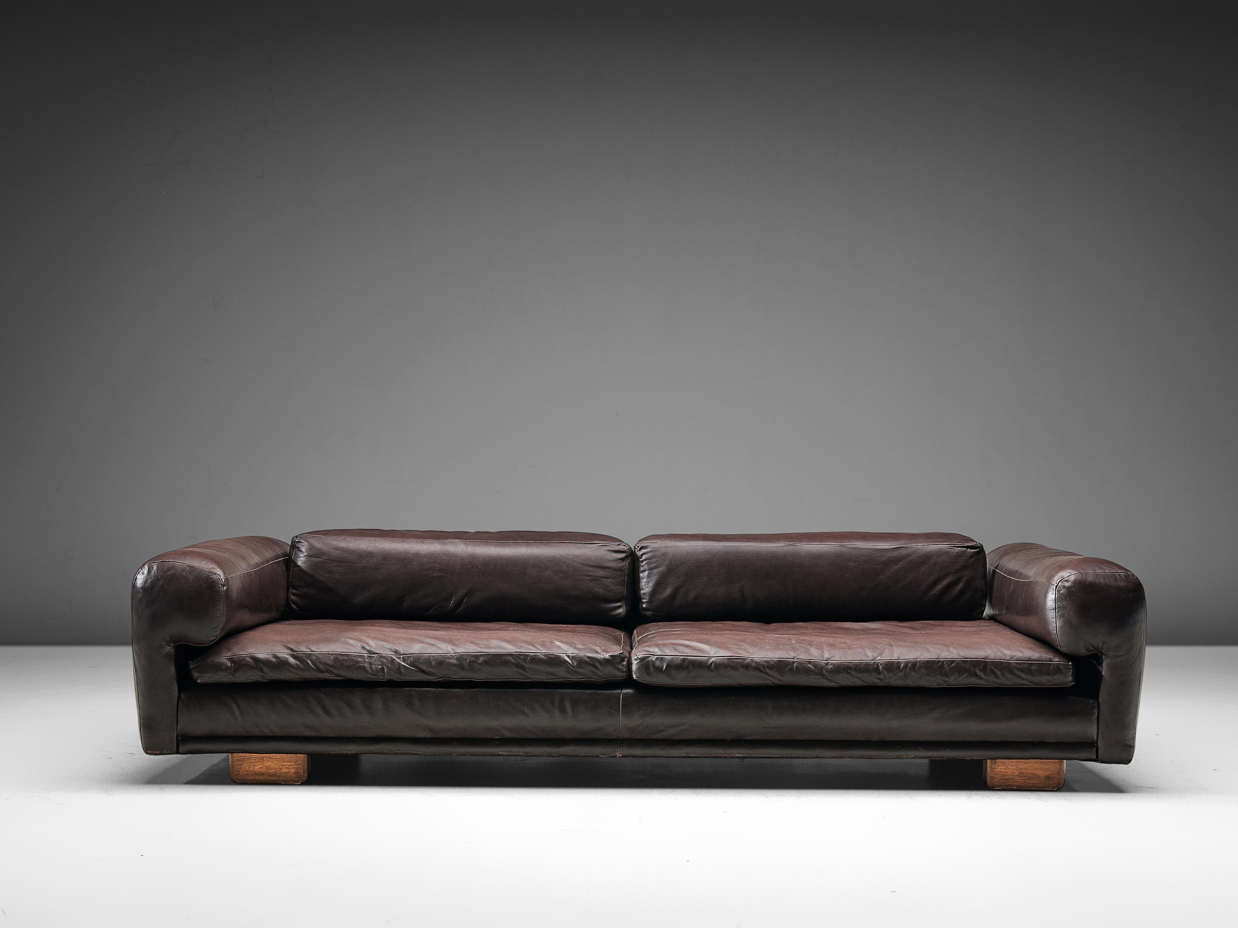 Howard Keith, 'Diplomat' sofa, black leather, wood, United Kingdom, 1970s.

Grand voluptuous sofa by Howard Keith for HK Furniture, designed in the 1970s. This sofa with a deep seat is a true delight to sit and relax in. The thick armrests, seat