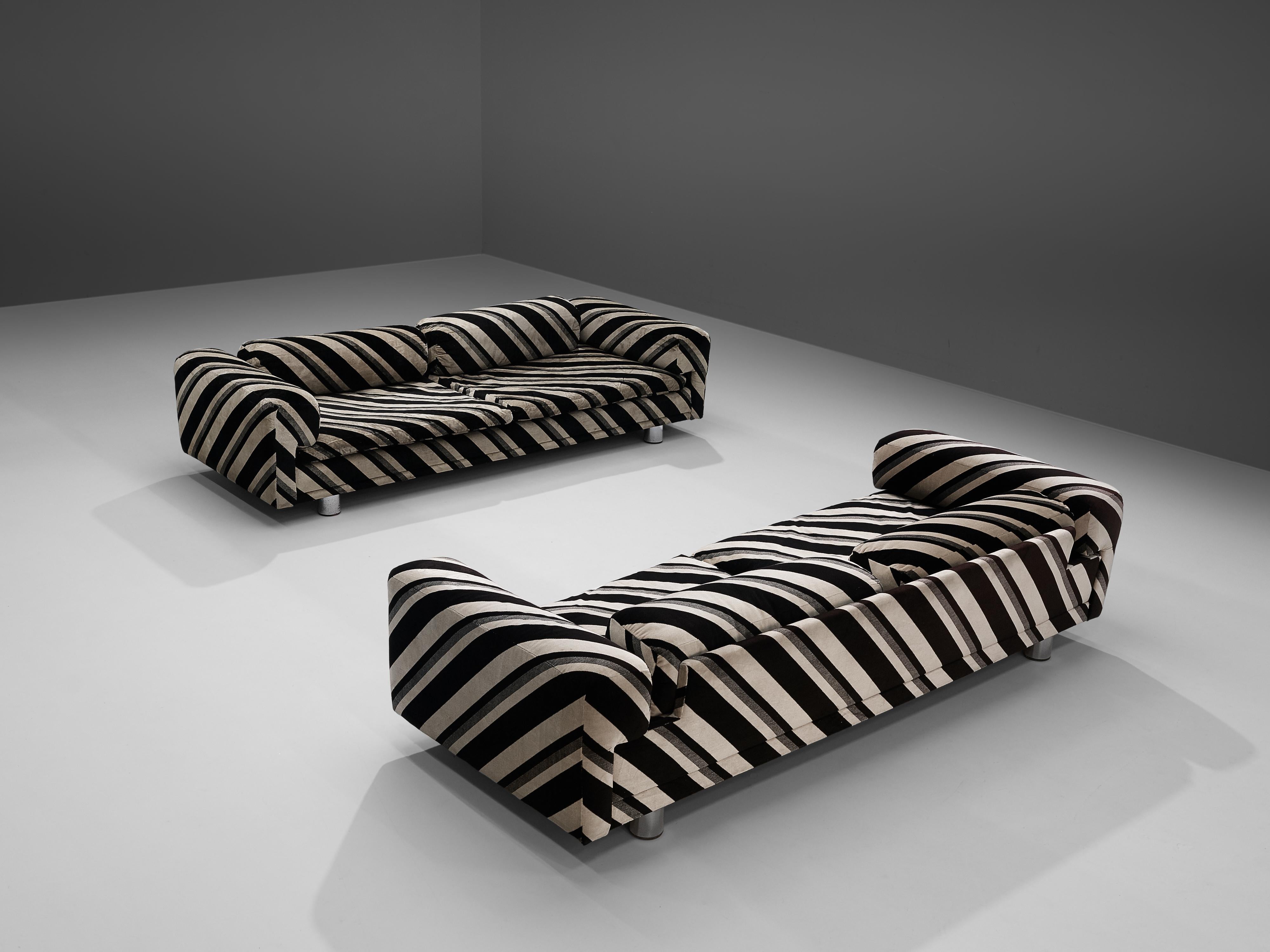 Howard Keith for HK Furniture, 'Diplomat' sofas, dark brown and beige striped fabric, metal, United Kingdom, 1970s.

Grand voluptuous 'Diplomat' sofas by Howard Keith for HK Furniture, designed in the 1970s. These two sofas with a deep seat are a