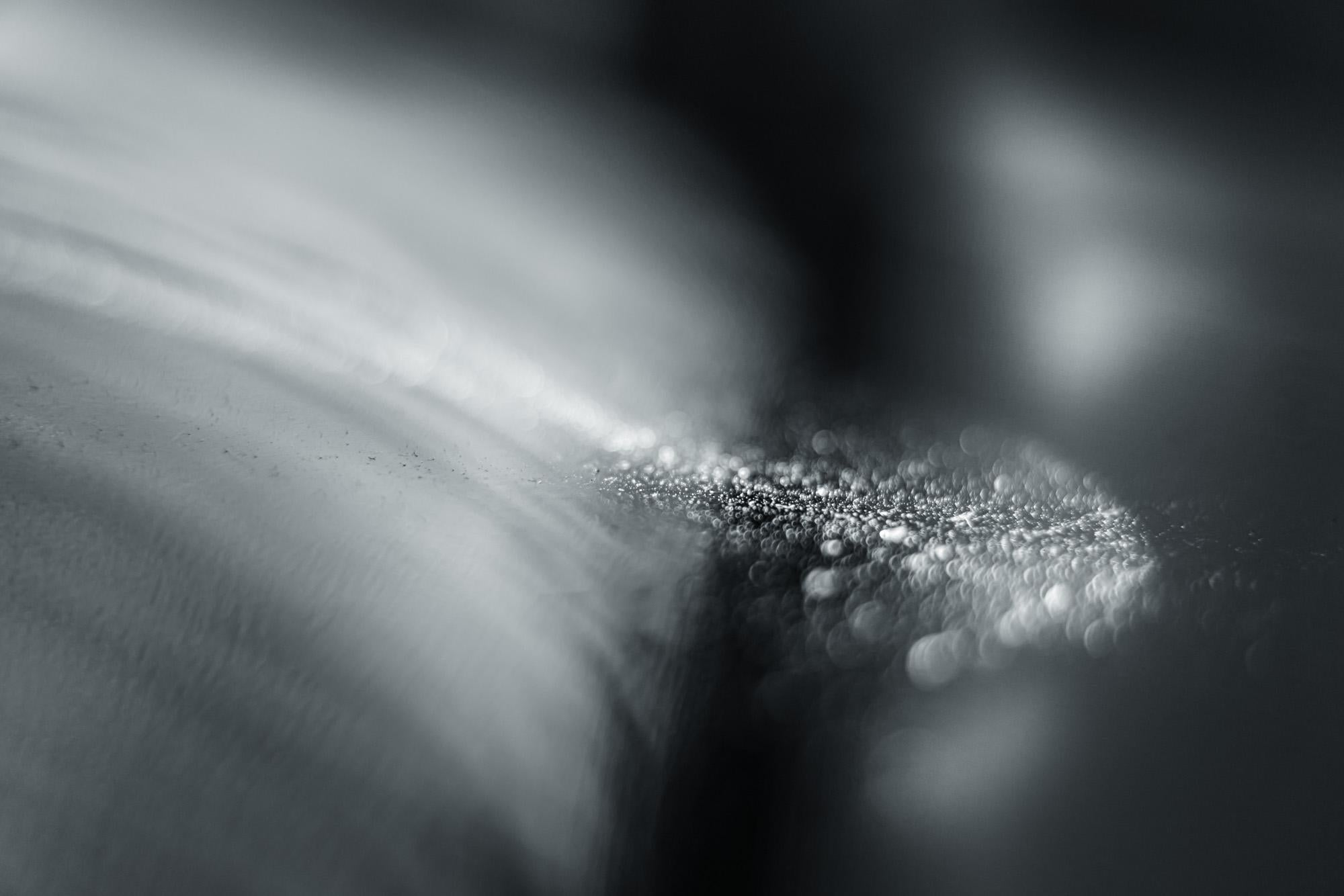 This is Untitled #16 from the Nature of Particles series.

The Nature of Particles series consists of abstract photographs of ordinary particulates, that we observe in our everyday surroundings as floating fragments seen in shafts of light.

My