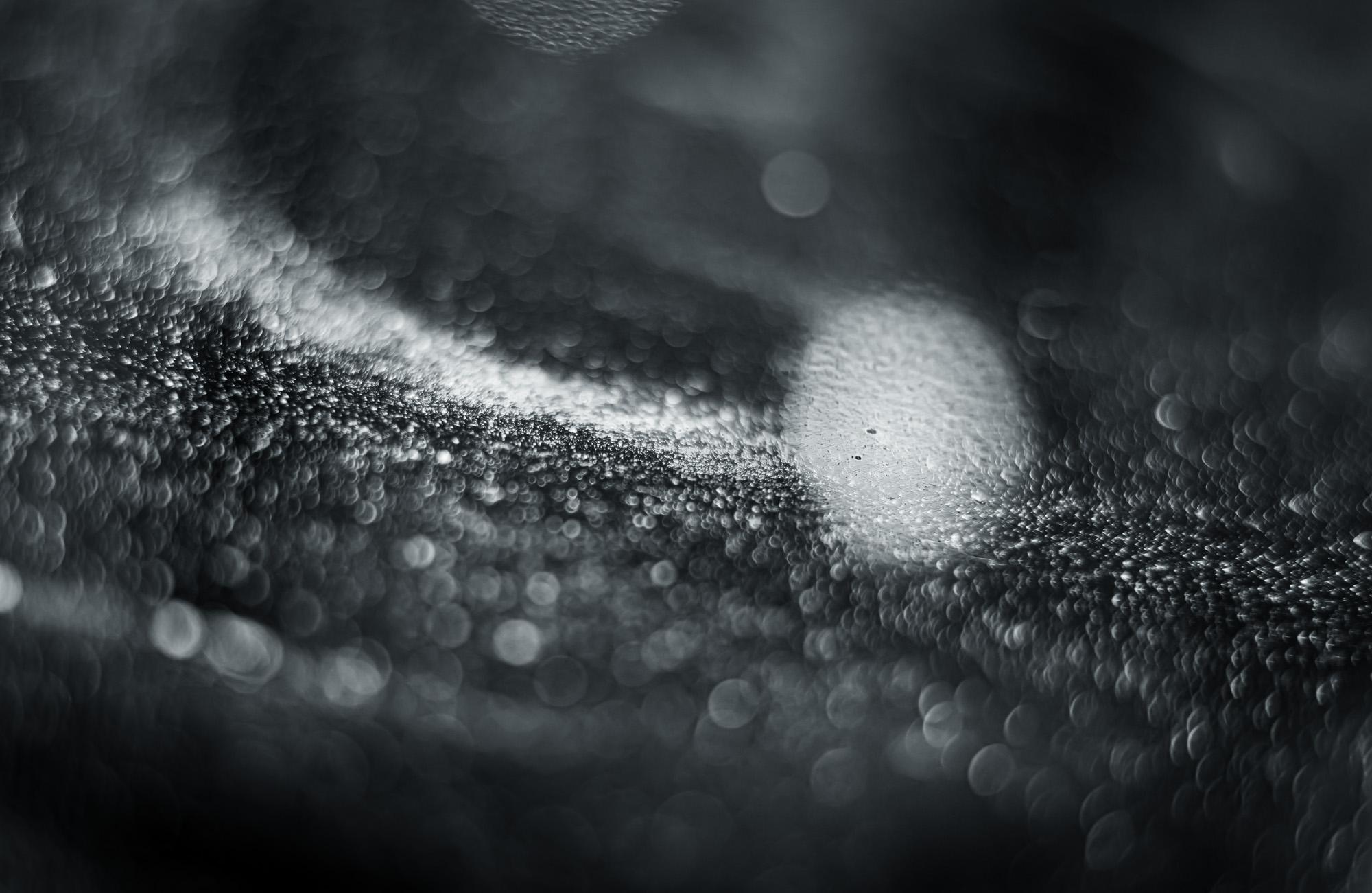 This is Untitled #28 from the Nature of Particles series.

The Nature of Particles series consists of abstract photographs of ordinary particulates, that we observe in our everyday surroundings as floating fragments seen in shafts of light.

My