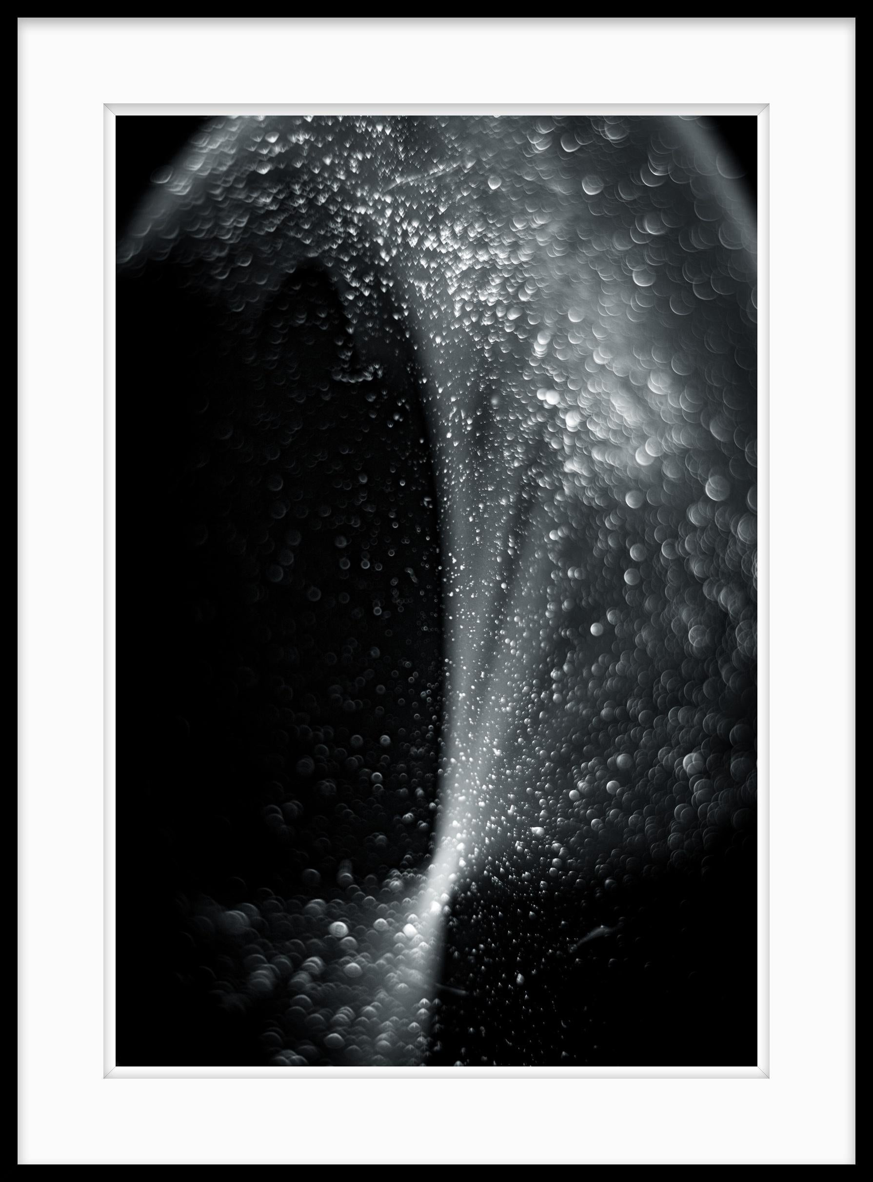 This is Untitled #40 from the Nature of Particles series.

The Nature of Particles series consists of abstract photographs of ordinary particulates, that we observe in our everyday surroundings as floating fragments seen in shafts of light.

My