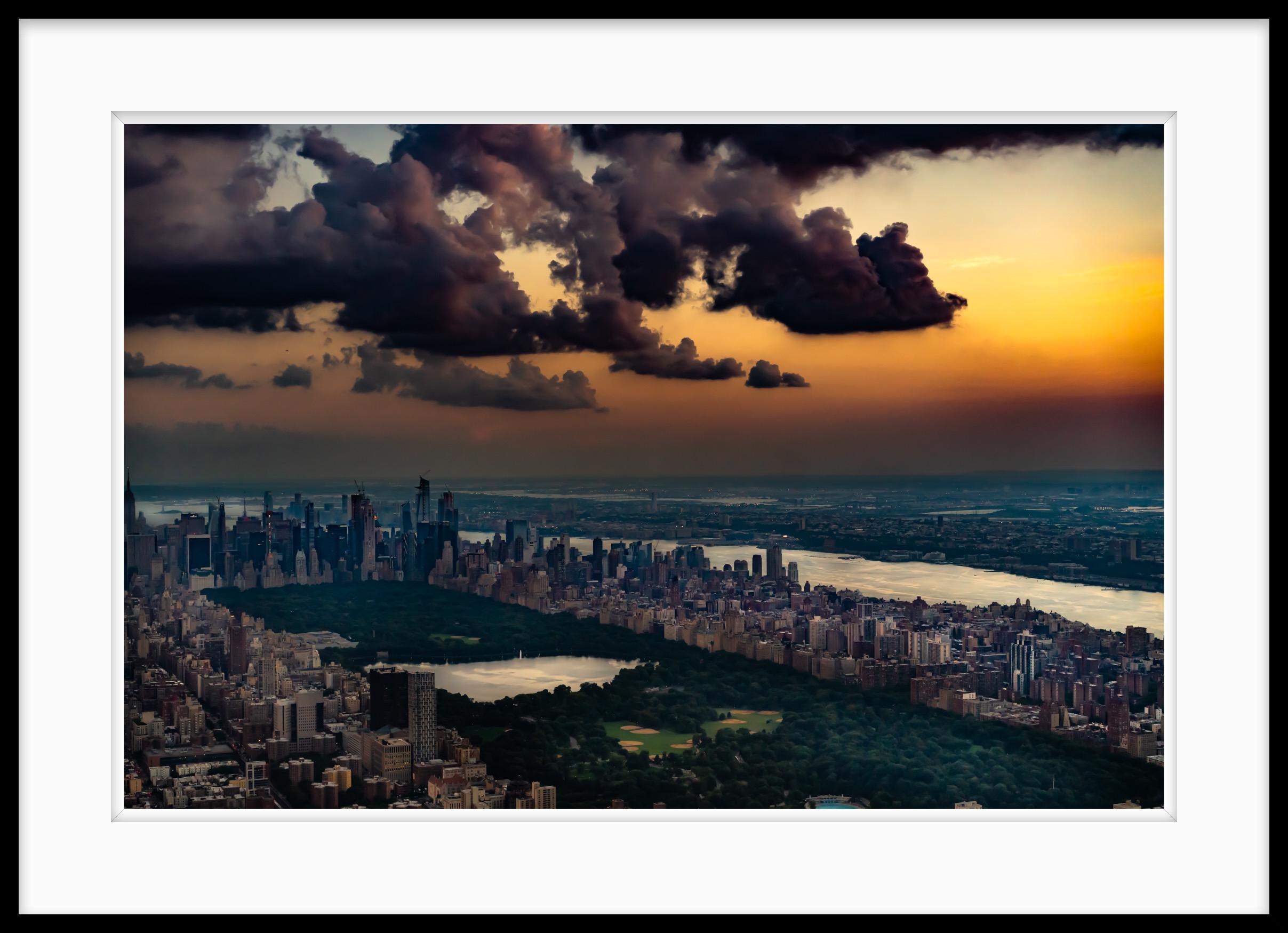 Limited Edition Color Photograph - New York aerial, Central Park, 2018. When the ban on taking the doors off of helicopters for photography was lifted I flew over New York City late in the day just after storms had passed. Central Park with the lake