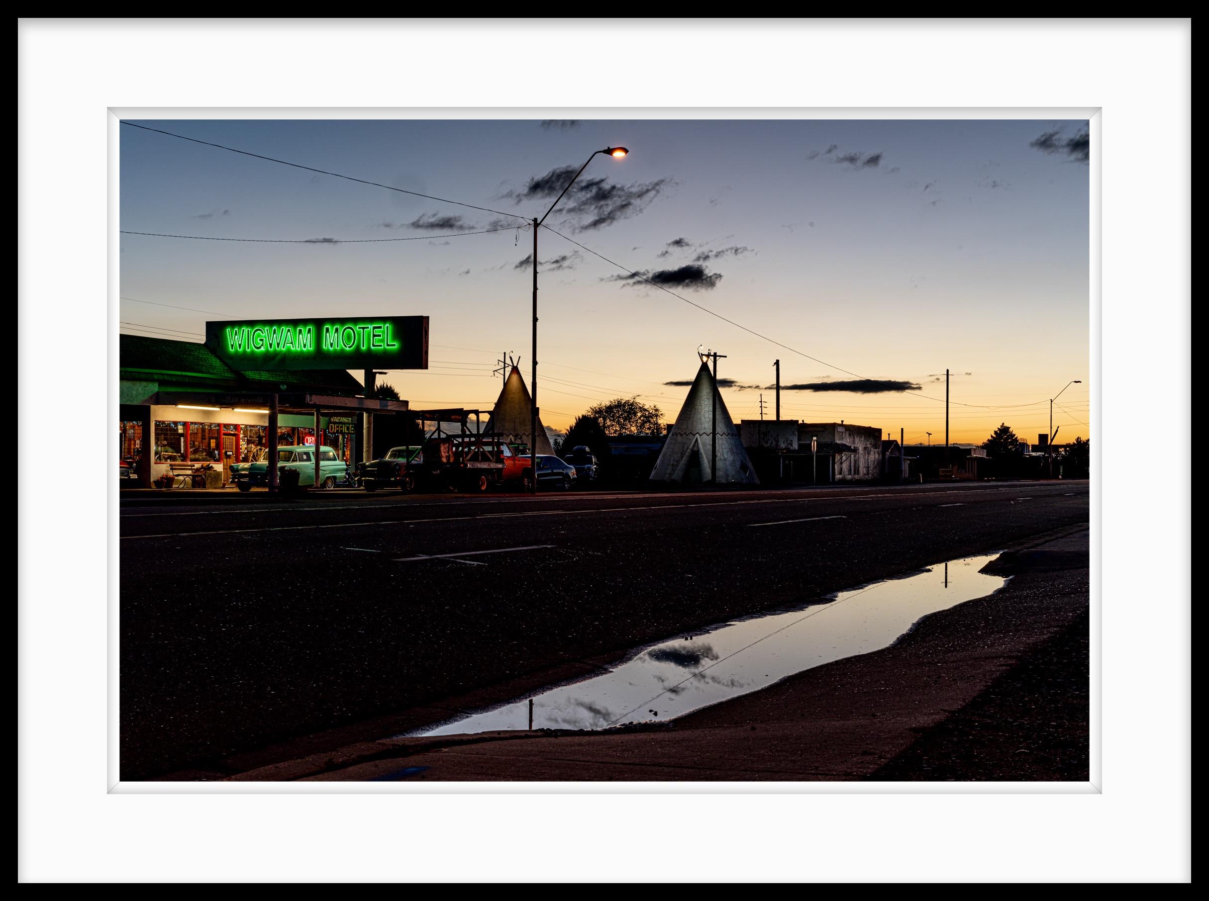 Limited Edition Color Photograph Rt. 66  Iconic Neon. I was on a long photographic exploration road trip through the American West and I happened along this Rt. 66 icon just after sunset and and a light rain.

About:
Lewis’ artistic practice often