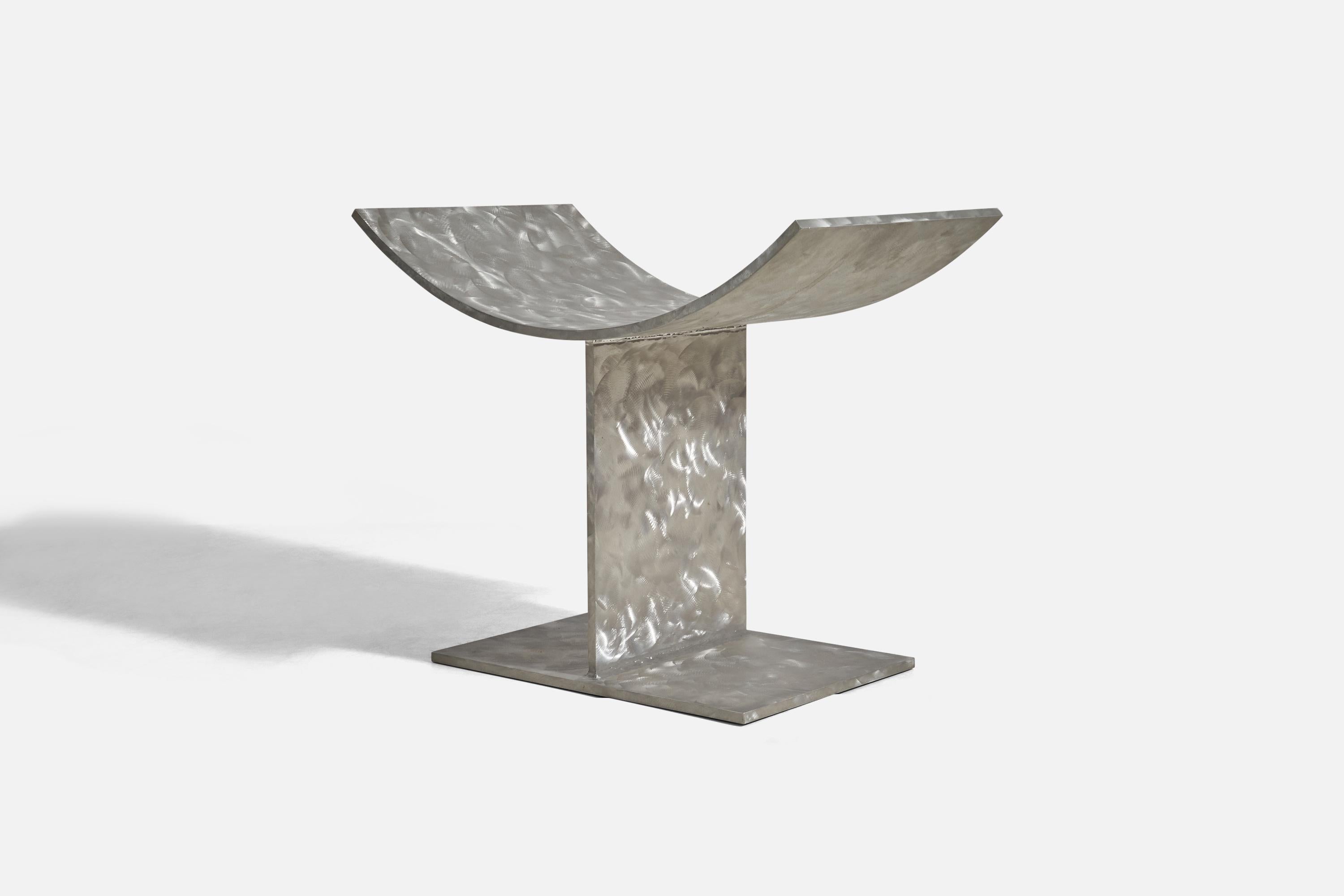A brushed aluminum stool, mod. 
