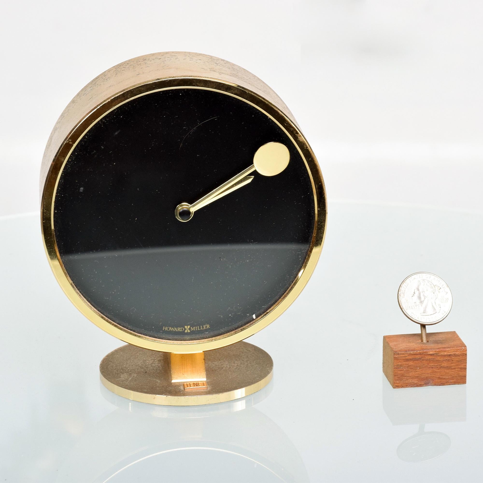 Howard Miller Mid-Century Modern vintage patinated brass desk table clock 1970s
Battery operation. Brass has original vintage patina. Stamped China.
Measures: 5 3/8