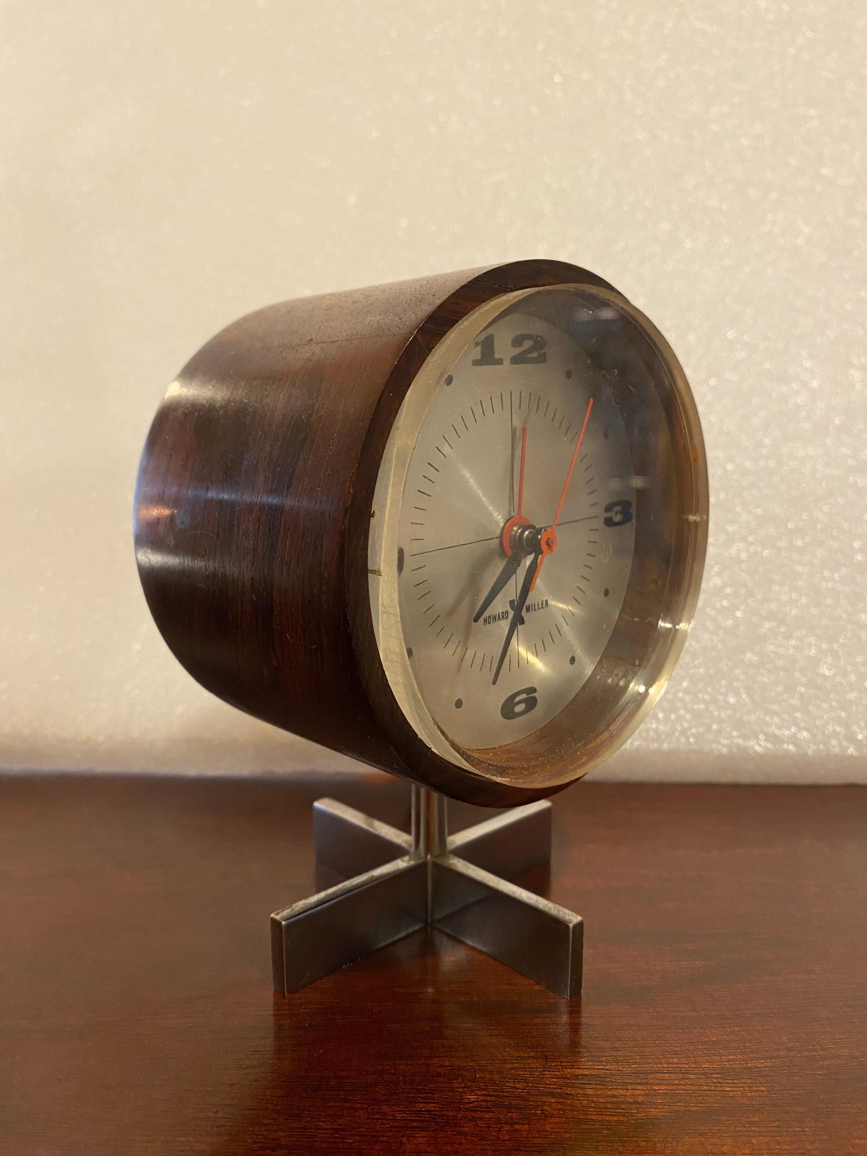Arthur Umanoff for The Design Office of George Nelson for Howard Miller Rosewood Desk or Table Clock.  In great shape and running flawlessly!  Been in use for about 6 months on my desk at the store!  Beautiful Grain case with a lucite crystal.