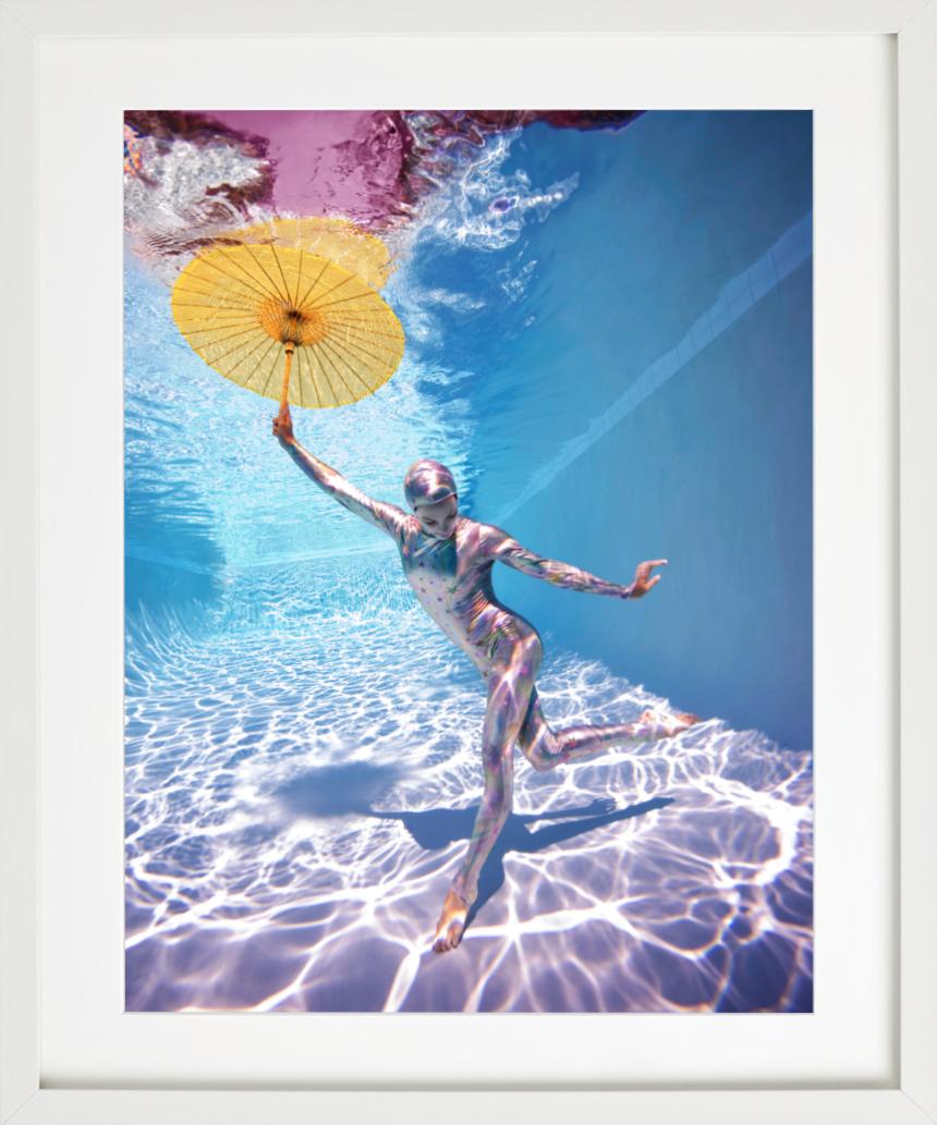 Underwater Study # 2778 - model posing underwater in bodysuit with umbrella - Blue Color Photograph by Howard Schatz