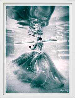 Underwater Study #3180 - model in dress swimming in water in sepia