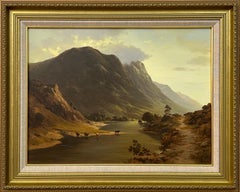 Cattle drinking water from a Loch in the Mountains of the Scottish Highlands