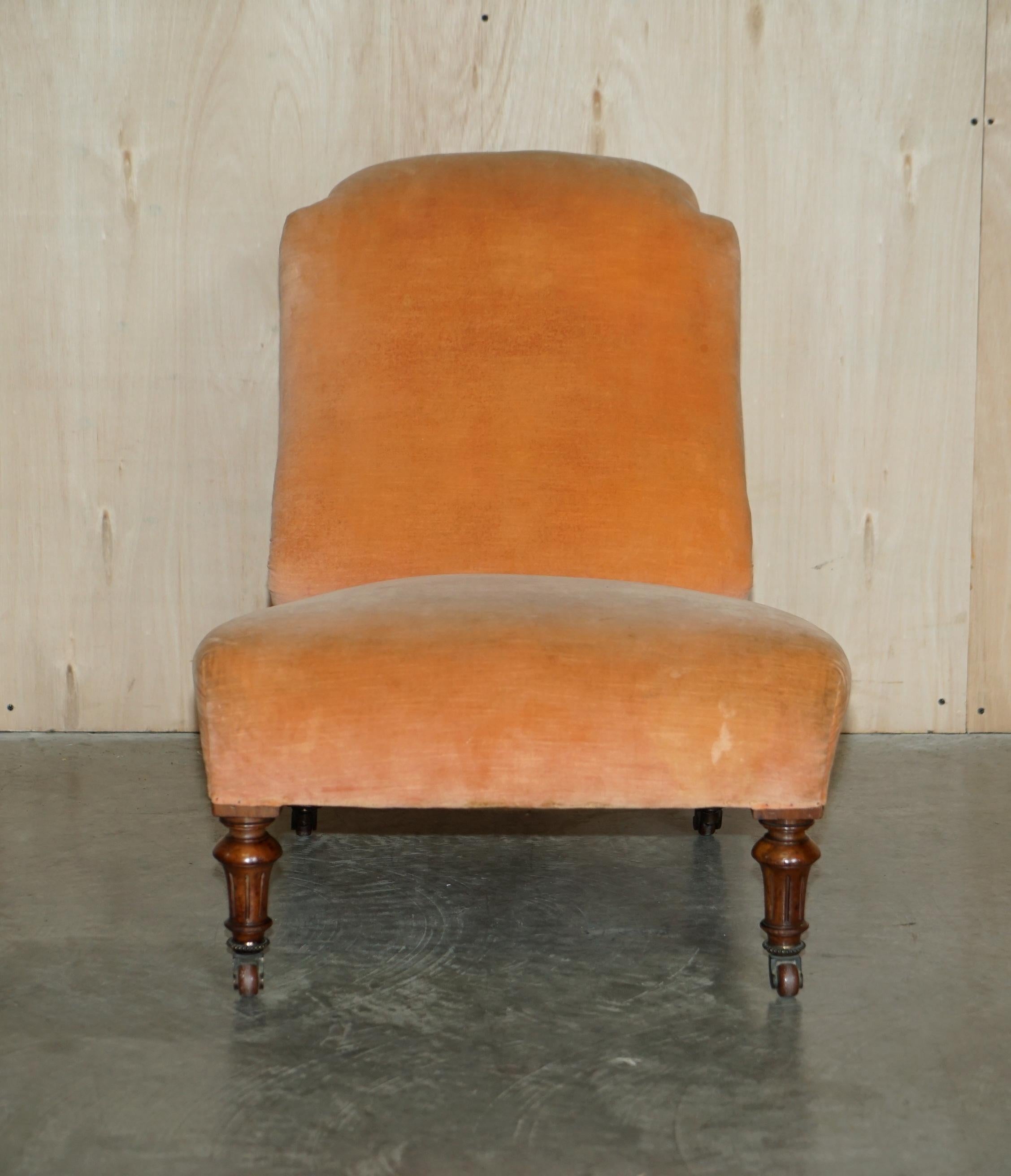 We are delighted to offer for sale this very nice Victorian circa 1860 Howard & Son's attributed, walnut framed nursing chair with peach velour upholstery and period porcelain castors 

A nicely made genuine Victorian antique, it is as mentioned a