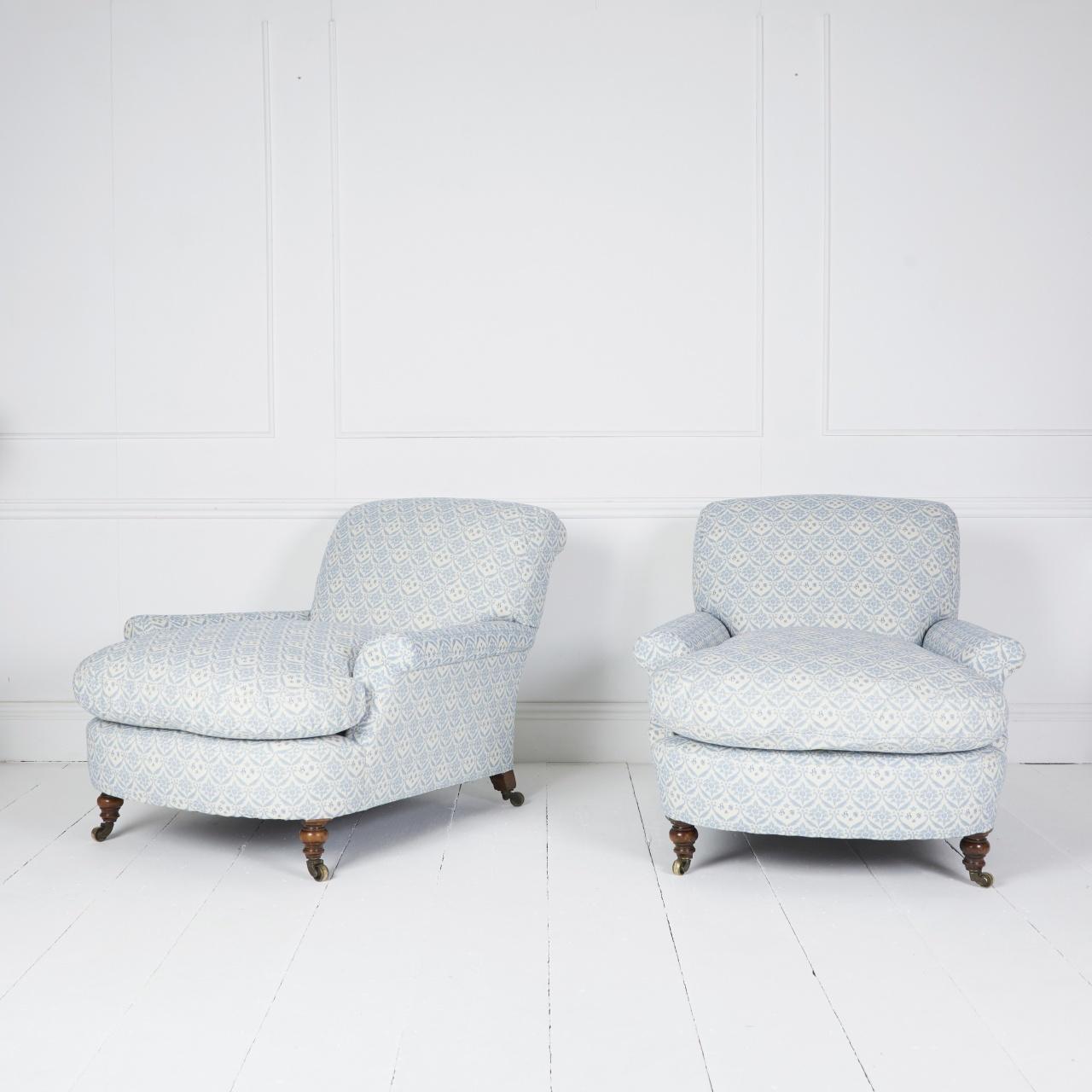 Early large deep seated Howard club armchairs covered in blue and cream H&S ticking standing on English Walnut turned legs and original castors.

Made by Howard & Sons London C.1860

Dimensions: H 30″  W 34″ D 46″ SD30″ SH 16″

Ref MS 192