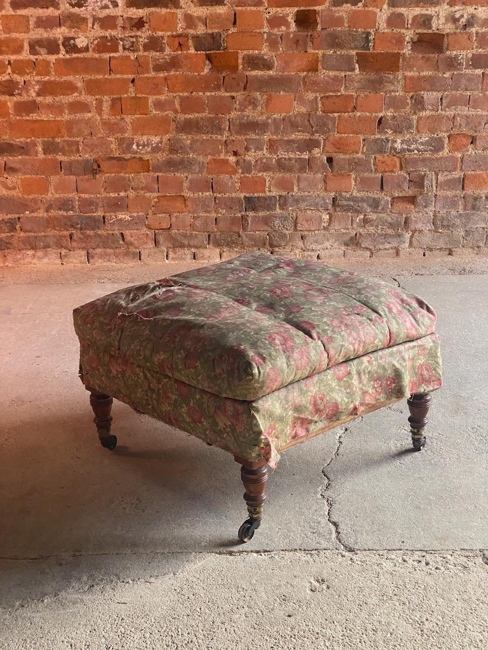 Antique Howard & Sons footstool 19th Century England Circa 1860

A magnificent antique 19th century Howard & Sons Footstool England circa 1860, the square attached cushion down top and base covered in floral print fabric, raised on four turned