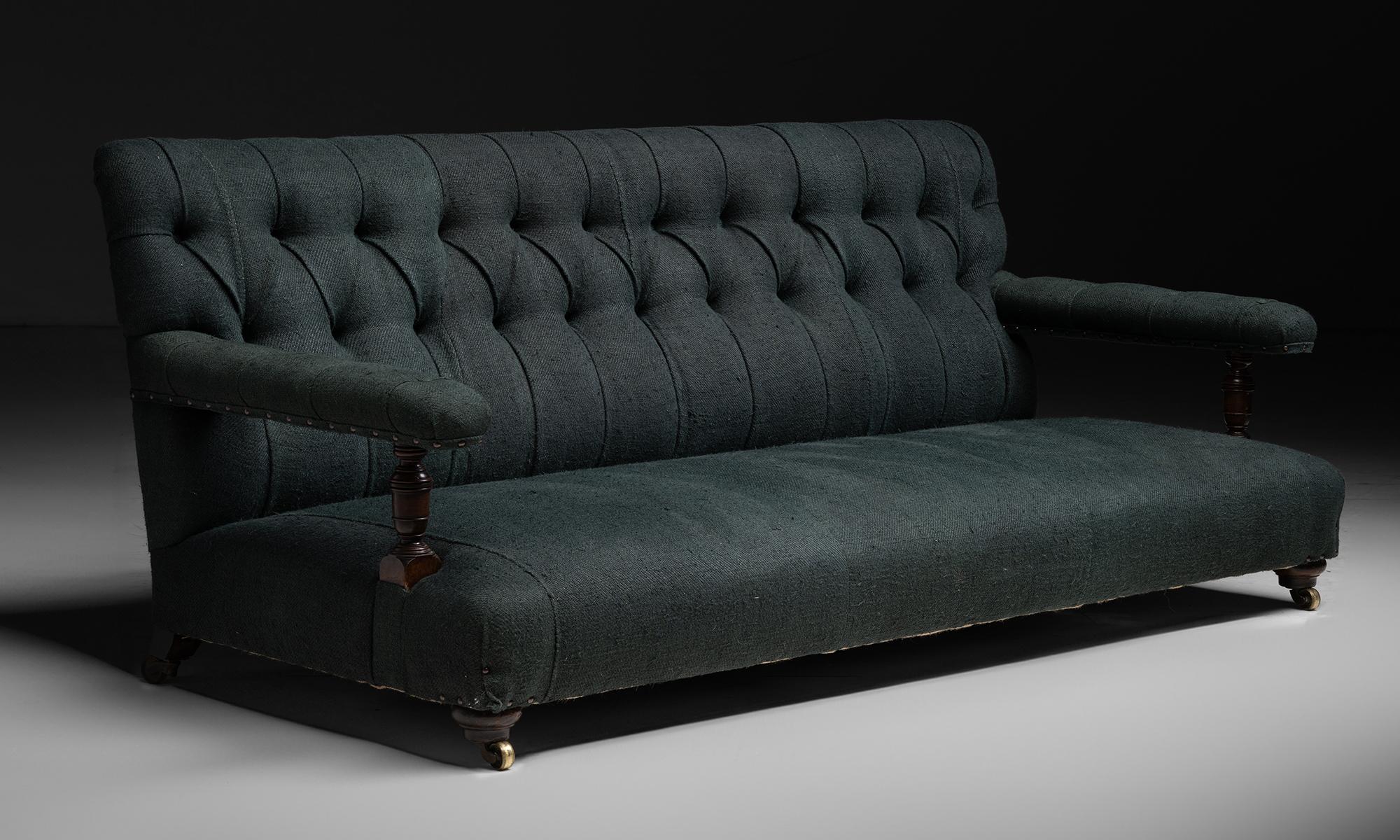 Howard & Sons Sofa

England circa 1880

Low seated turned walnut legs, upholstered in hand-dyed dark green grain sacks.

75”L x 32”d x 31”h x 9”seat