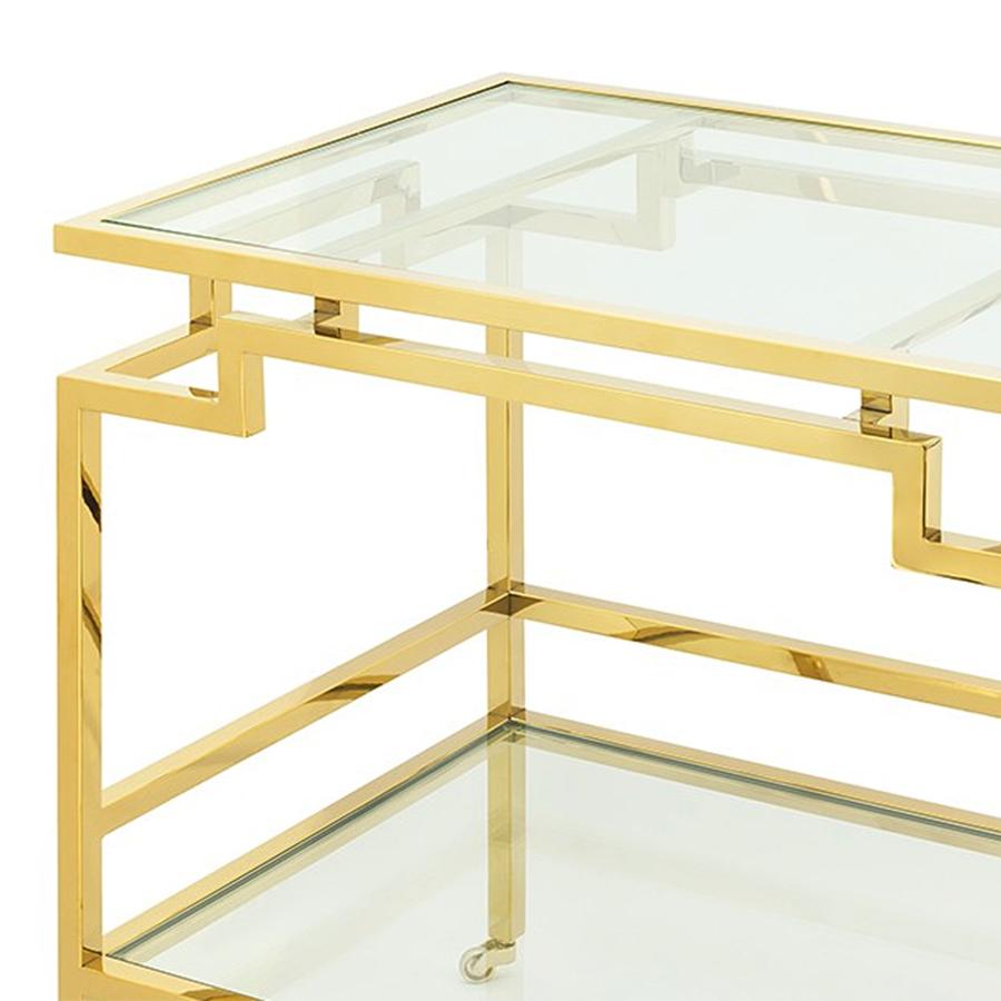 Trolley Howard bar carts, with steel structure in gold
finish and with 2 bevelled clear glass tops. Trolley on
rotating casters.