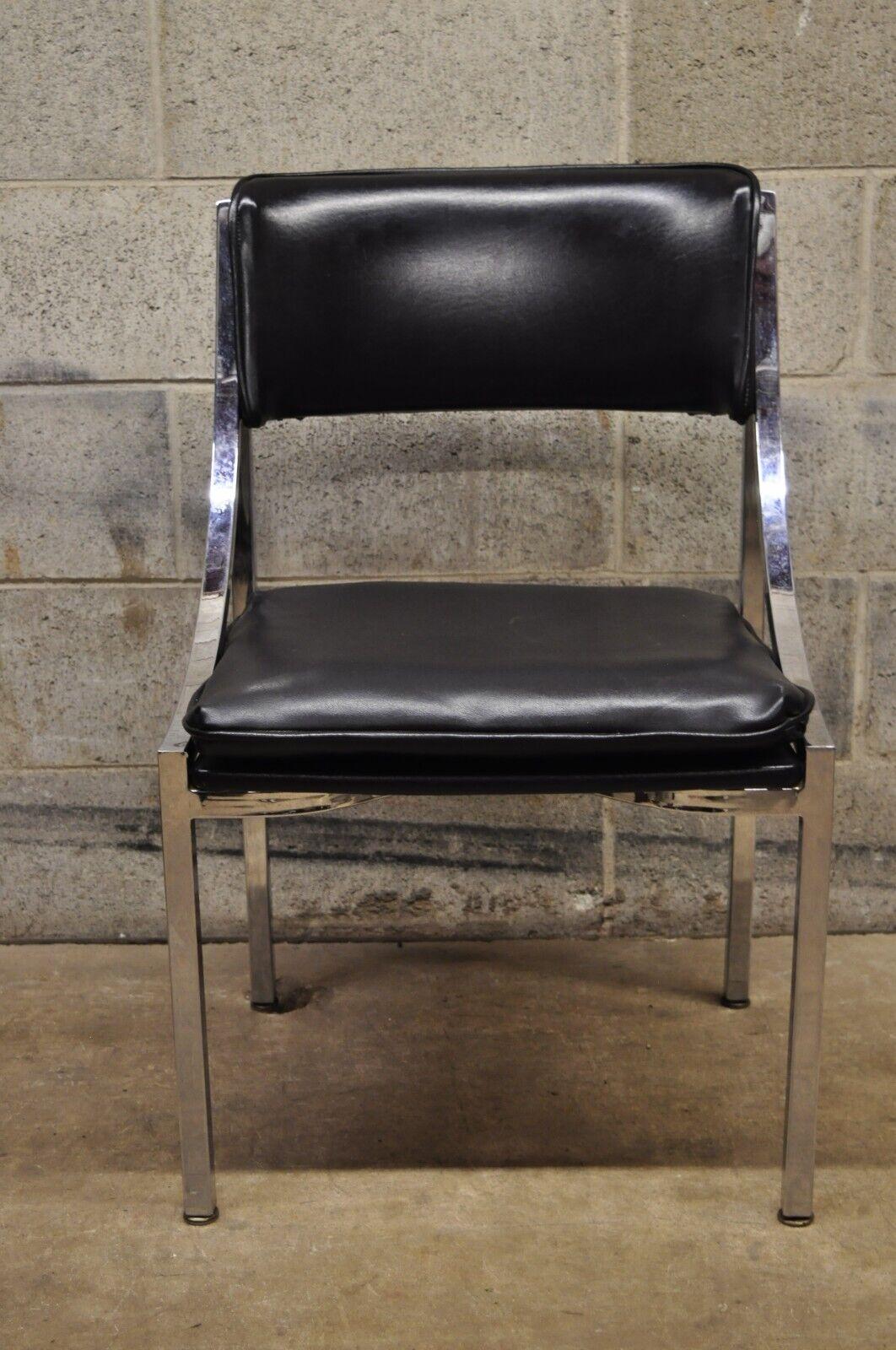 Howell Interlake Mid-Century Modern sleek chrome black vinyl dining chair. Item features a sleek chrome frame, Black Naugahyde upholstery, loose cushion, very nice vintage chairs, sleek sculptural form. Circa 1970. Measurements: 31.5