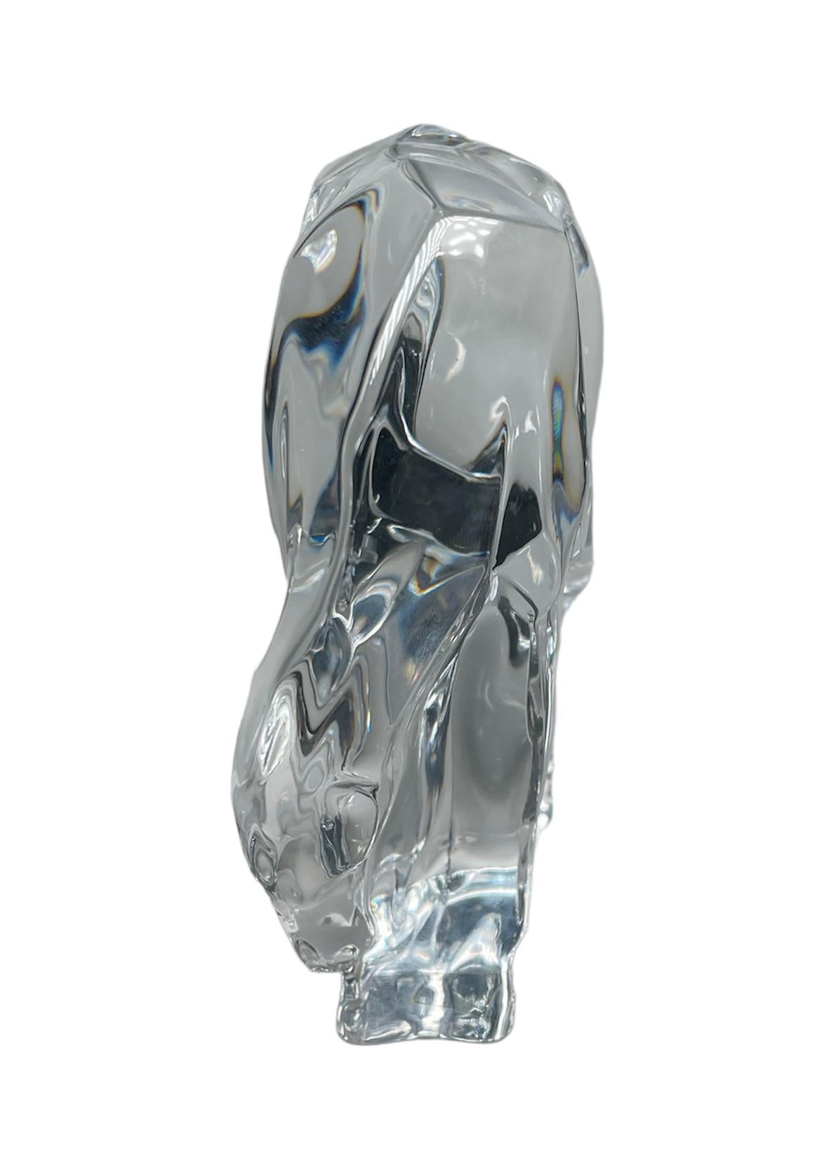 This is a Hoya Clear Crystal horse sculpture. It depicts a very well done relax horse in grazing position. The horse sculpture is standing also over a clear crystal rectangular base. Under the base, it is the Hoya Crystal made in Japan stamp.