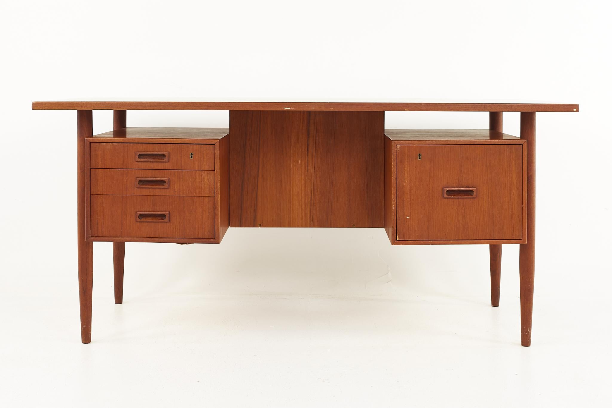 HP Hansen mid-century Danish teak desk

The desk measures: 62.5 wide x 31.5 deep x 29.5 inches high

All pieces of furniture can be had in what we call restored vintage condition. That means the piece is restored upon purchase so it’s free of