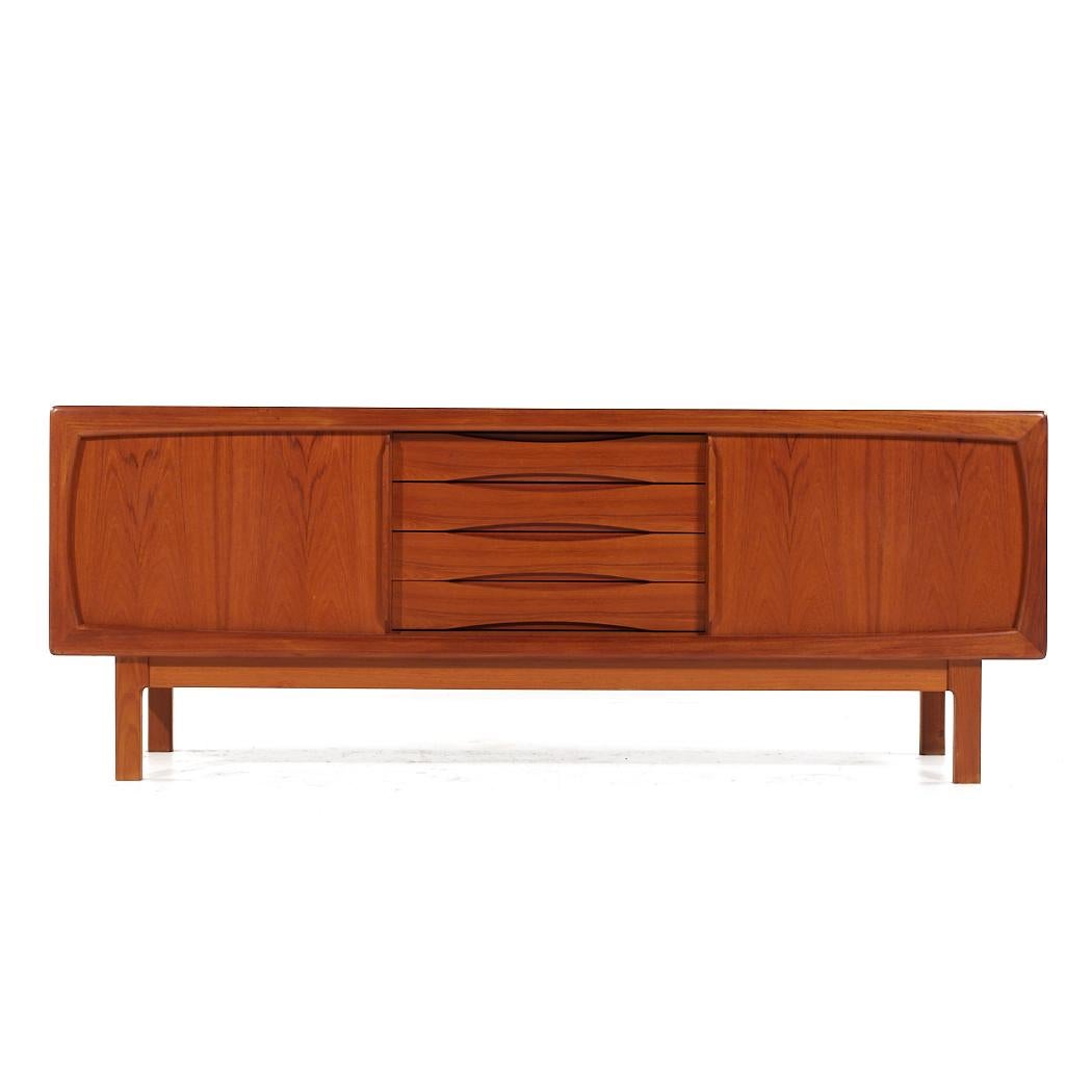 HP Hansen Mid Century Danish Teak Sliding Door Credenza

This credenza measures: 78.25 wide x 19.25 deep x 29.5 inches high

All pieces of furniture can be had in what we call restored vintage condition. That means the piece is restored upon
