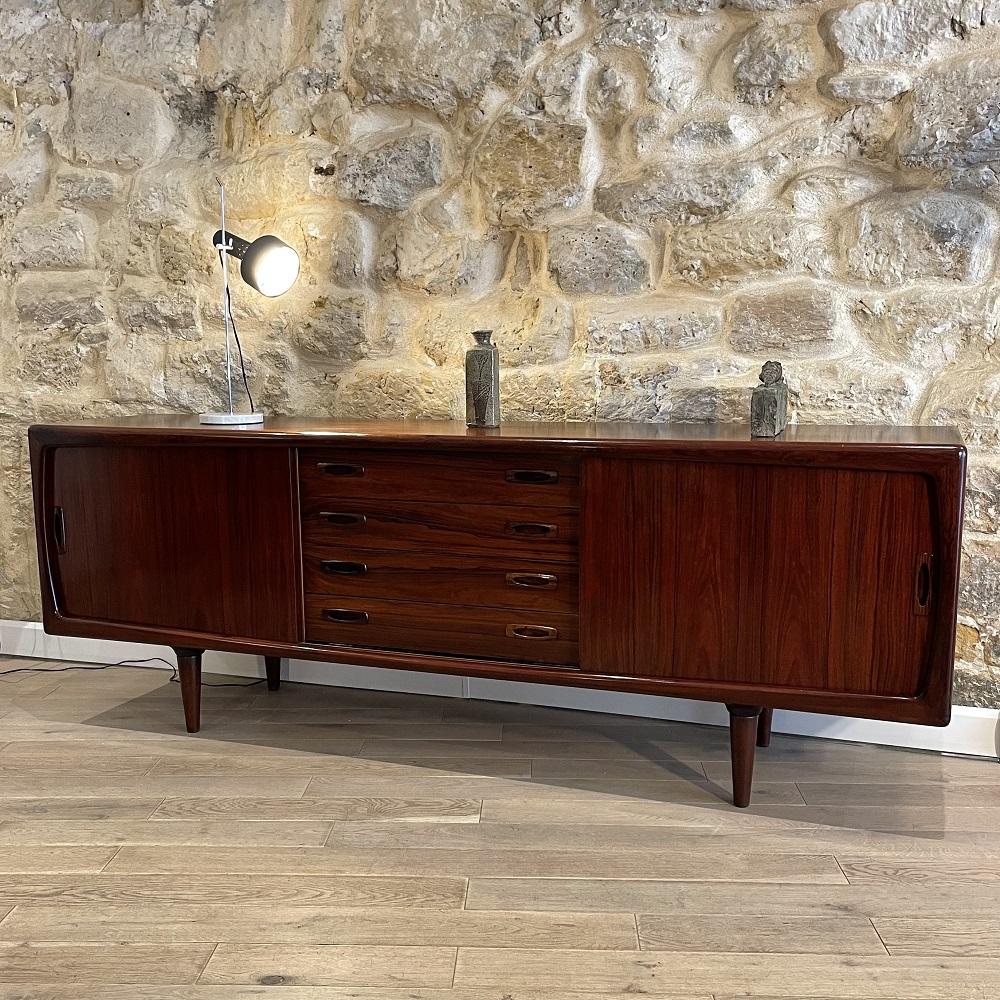 Rosewood sideboard, designed by Hans Peter Hansen for H.P Hansen Møbelindustri , in the 1960's. This sideboard is both functional and aesthetically beautiful. As a matter of fact, Hans Peter Hansen thought and designed it with three distinctive