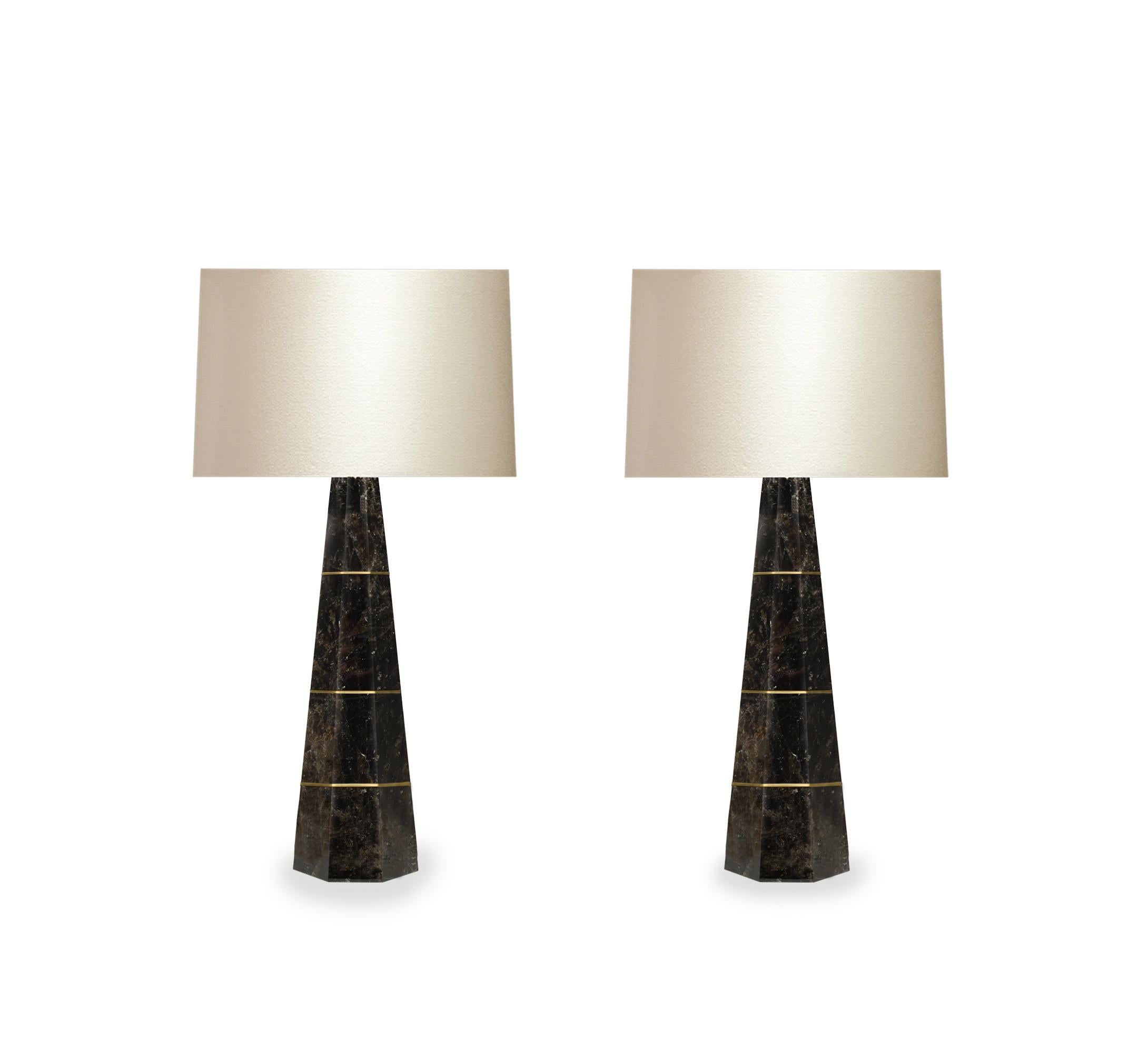 Pair of column smoky rock crystal quartz lamps with polished brass decoration. Created by Phoenix Gallery, NYC.
Measure: To the top of rock crystal: 21.5