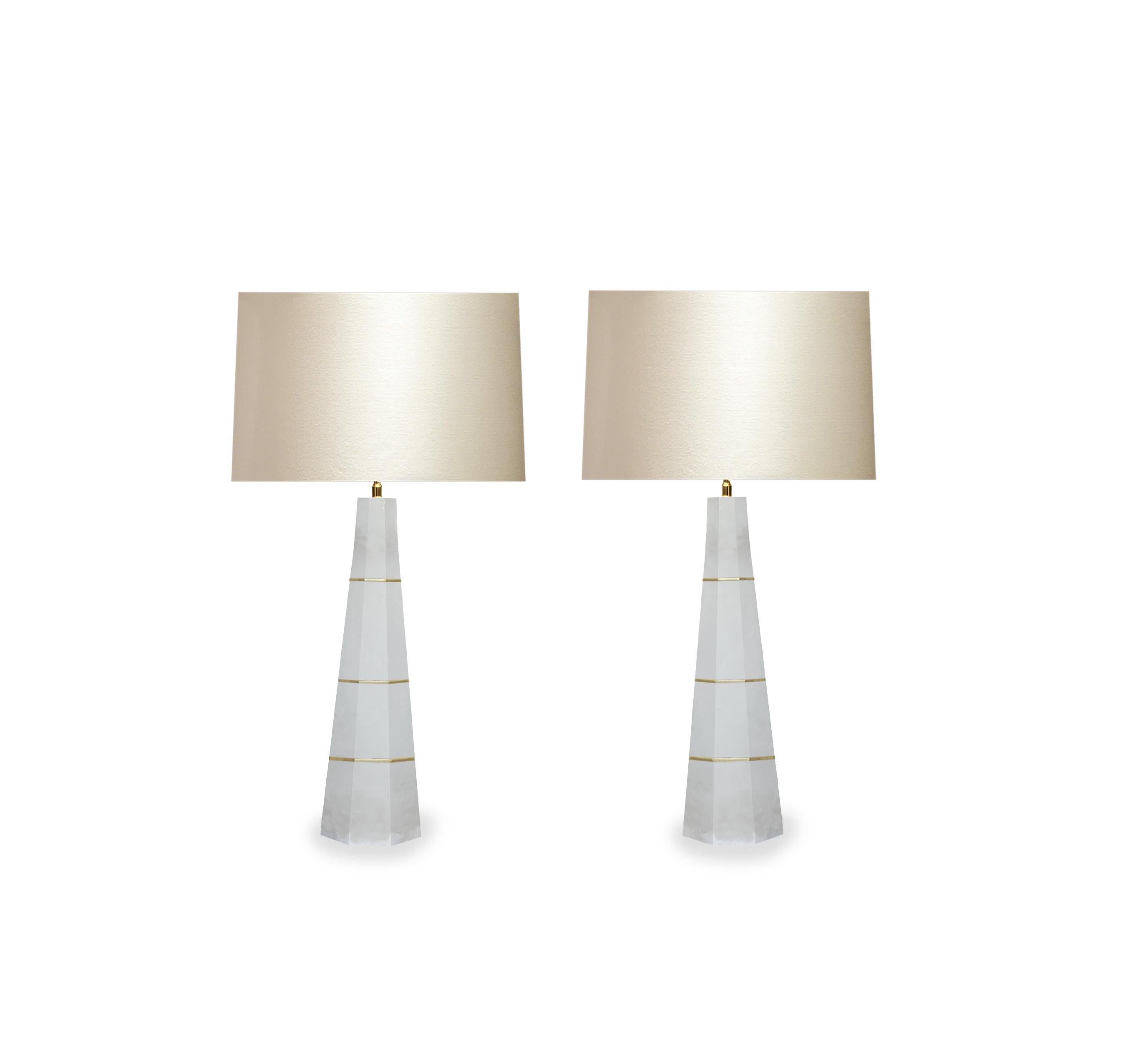 Pair of column rock crystal quartz lamps with polished brass decoration. Created by Phoenix Gallery, NYC.
Measure: To the top of rock crystal: 21.5