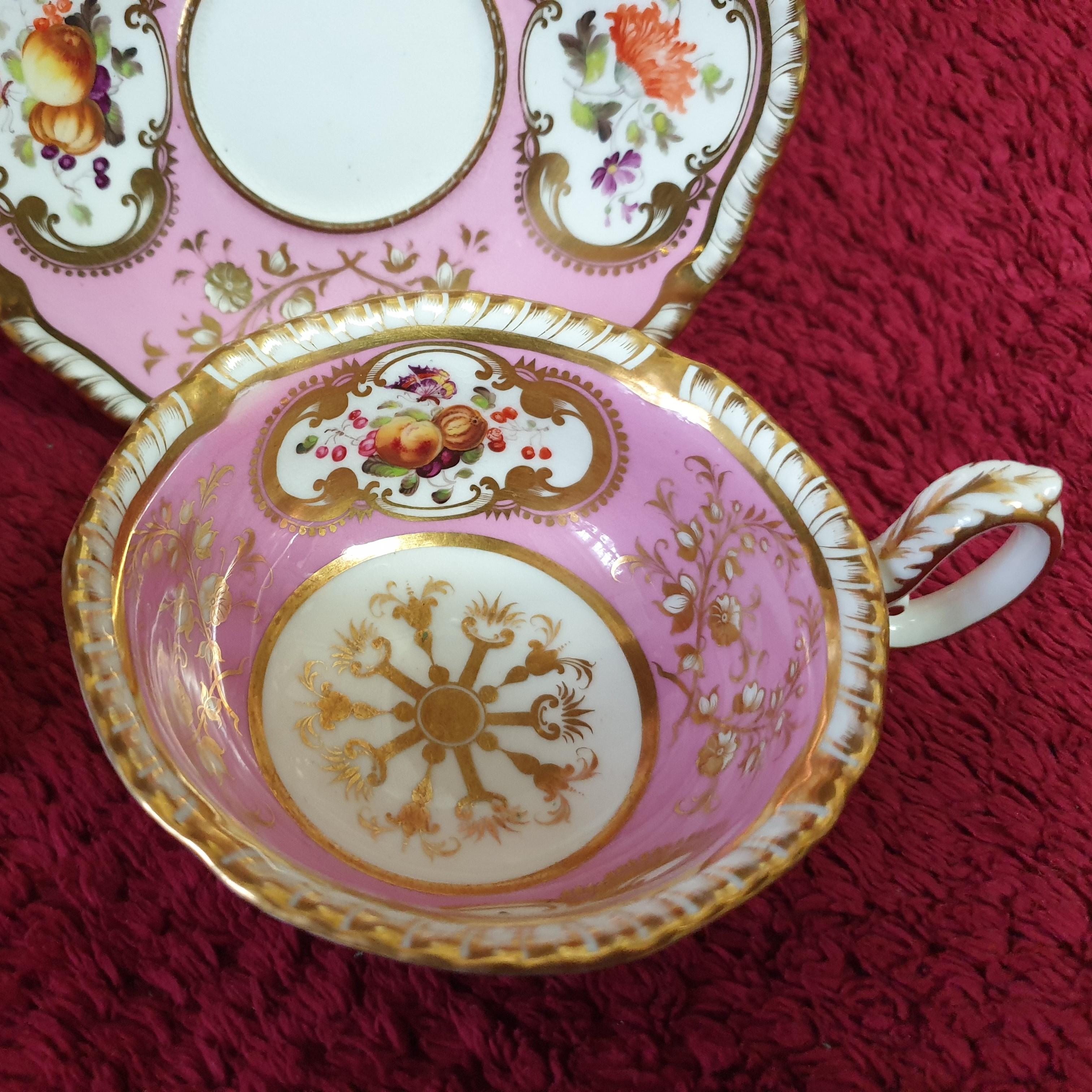 A stunning trio in baby pink is always a favourite and this H&R Daniel trio doesnt disappoint. Enclosed within a richly gilt cartouche are hand painted beautiful summer flowers in vivid colours and fruits on opposing sides of both cups and saucer.